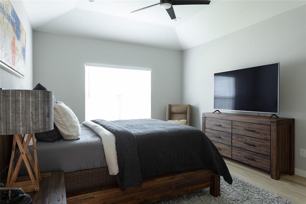1108 Claude Street Dallas, TX 75203 - Photo 11 of 17 Vaulted ceiling and a modern ceiling fan