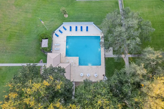 a front view of a building with a yard