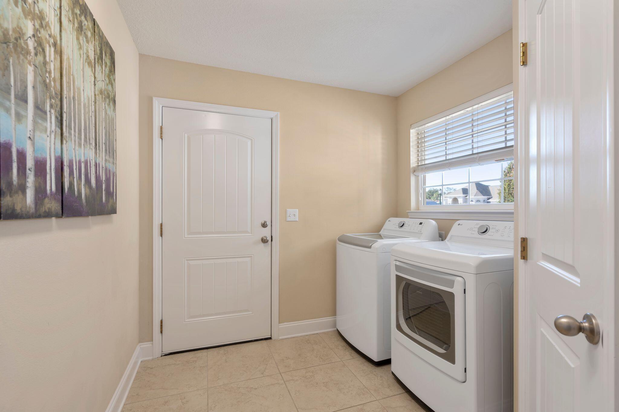 2933 Chancel Avenue Crestview, FL 32539 - Photo 16 of 44 a utility room with dryer and washer