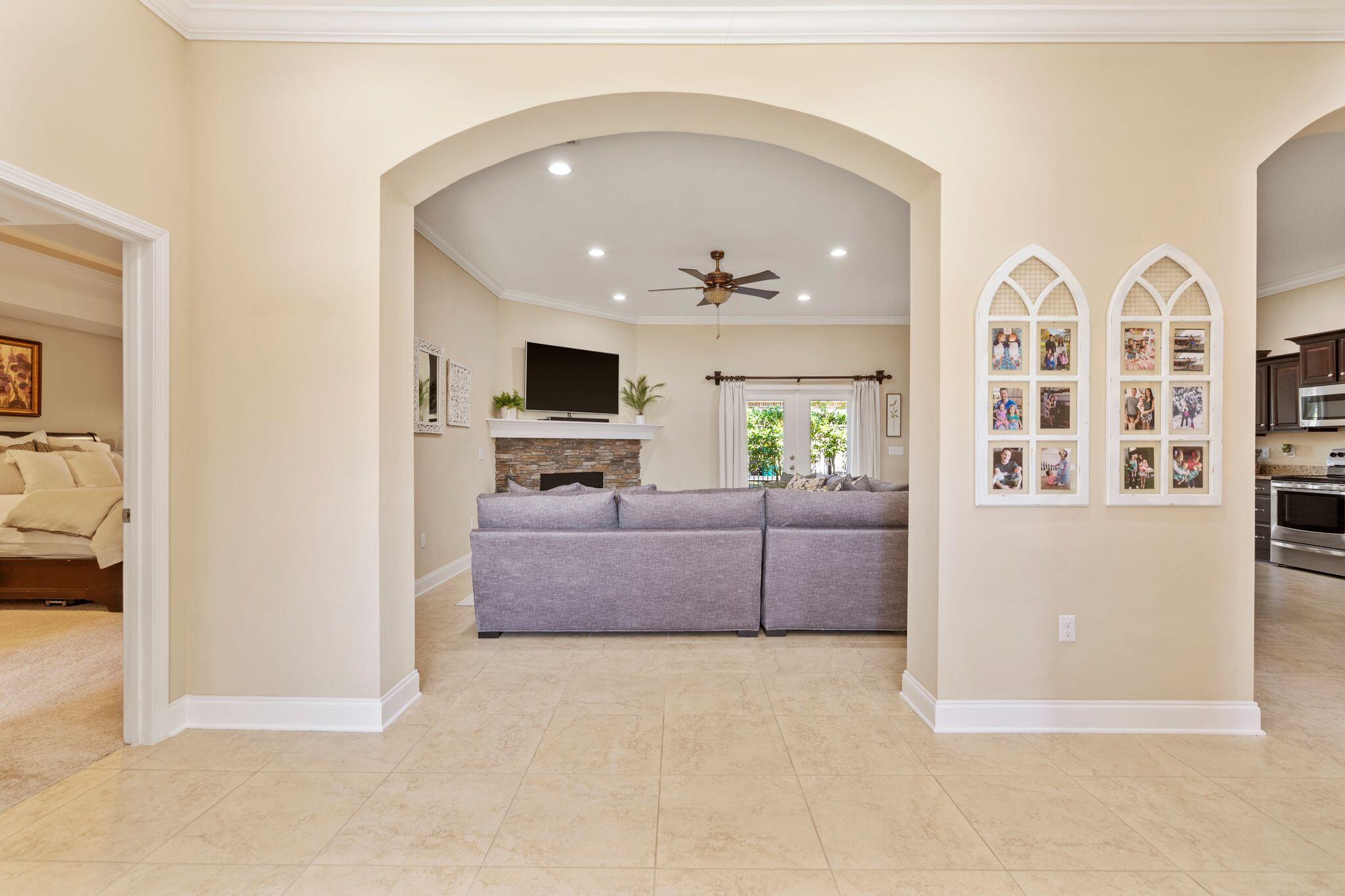 2933 Chancel Avenue Crestview, FL 32539 - Photo 18 of 44 a living room with furniture and a flat screen tv