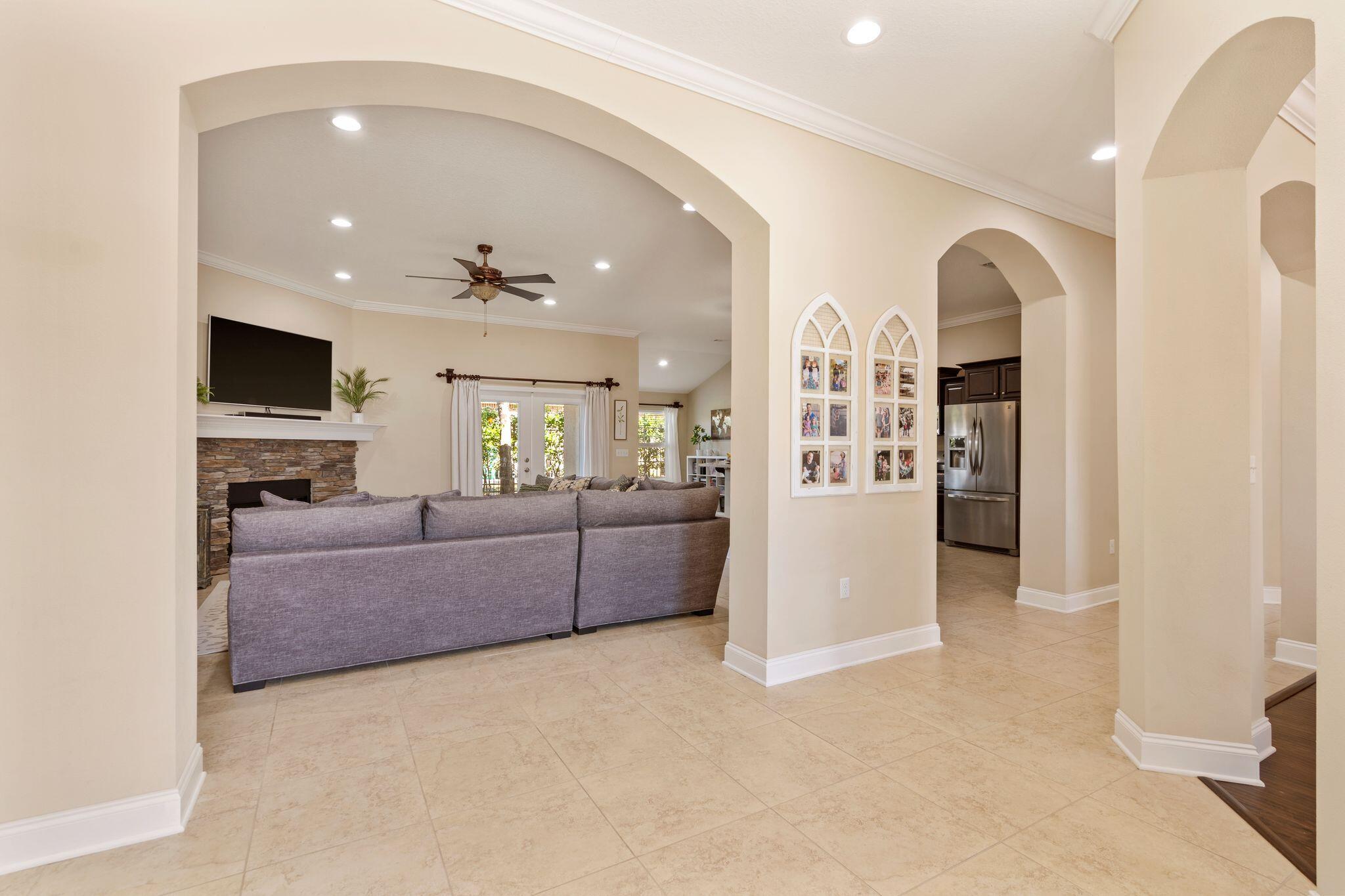 2933 Chancel Avenue Crestview, FL 32539 - Photo 19 of 44 a living room with furniture and a chandelier