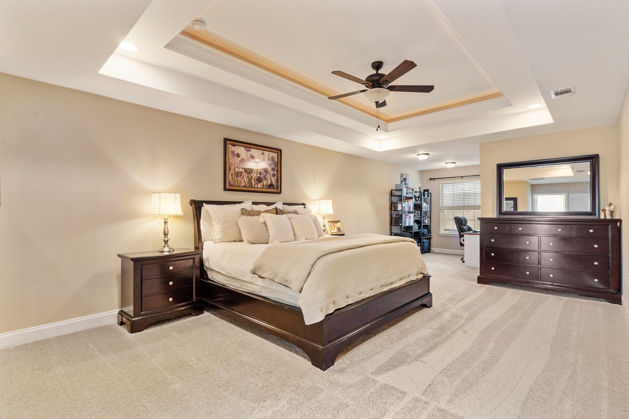 2933 Chancel Avenue Crestview, FL 32539 - Photo 20 of 44 a spacious bedroom with a bed and dresser