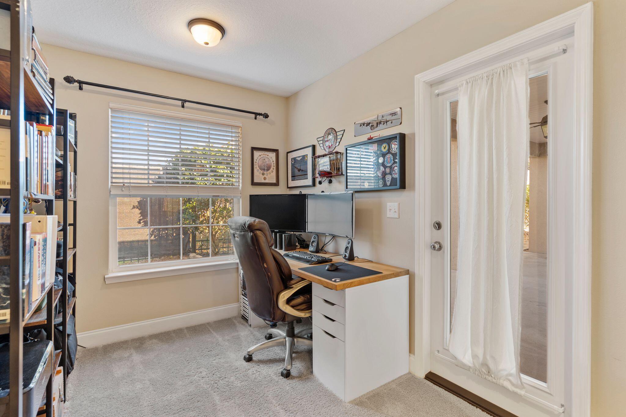 2933 Chancel Avenue Crestview, FL 32539 - Photo 23 of 44 a view of a workspace with furniture and a window