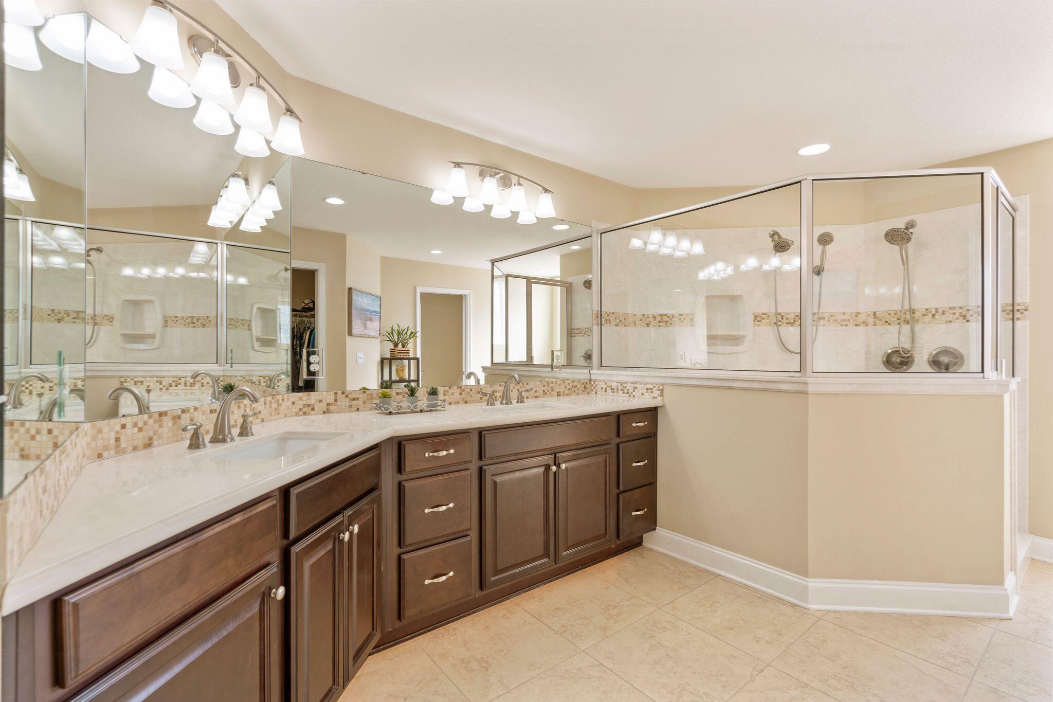 2933 Chancel Avenue Crestview, FL 32539 - Photo 25 of 44 a bathroom with a double vanity sink mirror and double