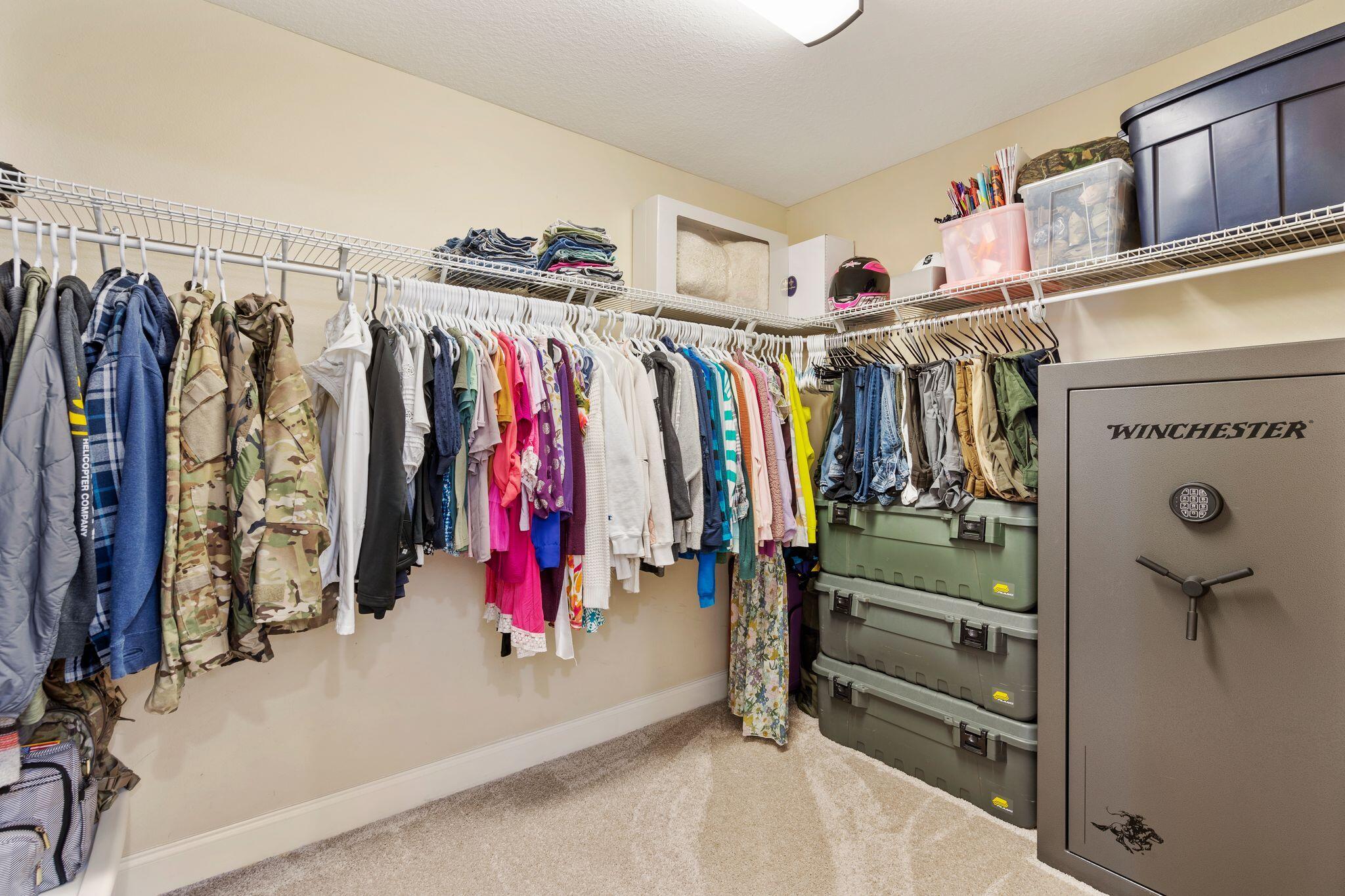 2933 Chancel Avenue Crestview, FL 32539 - Photo 26 of 44 a view of walk in closet with clothes