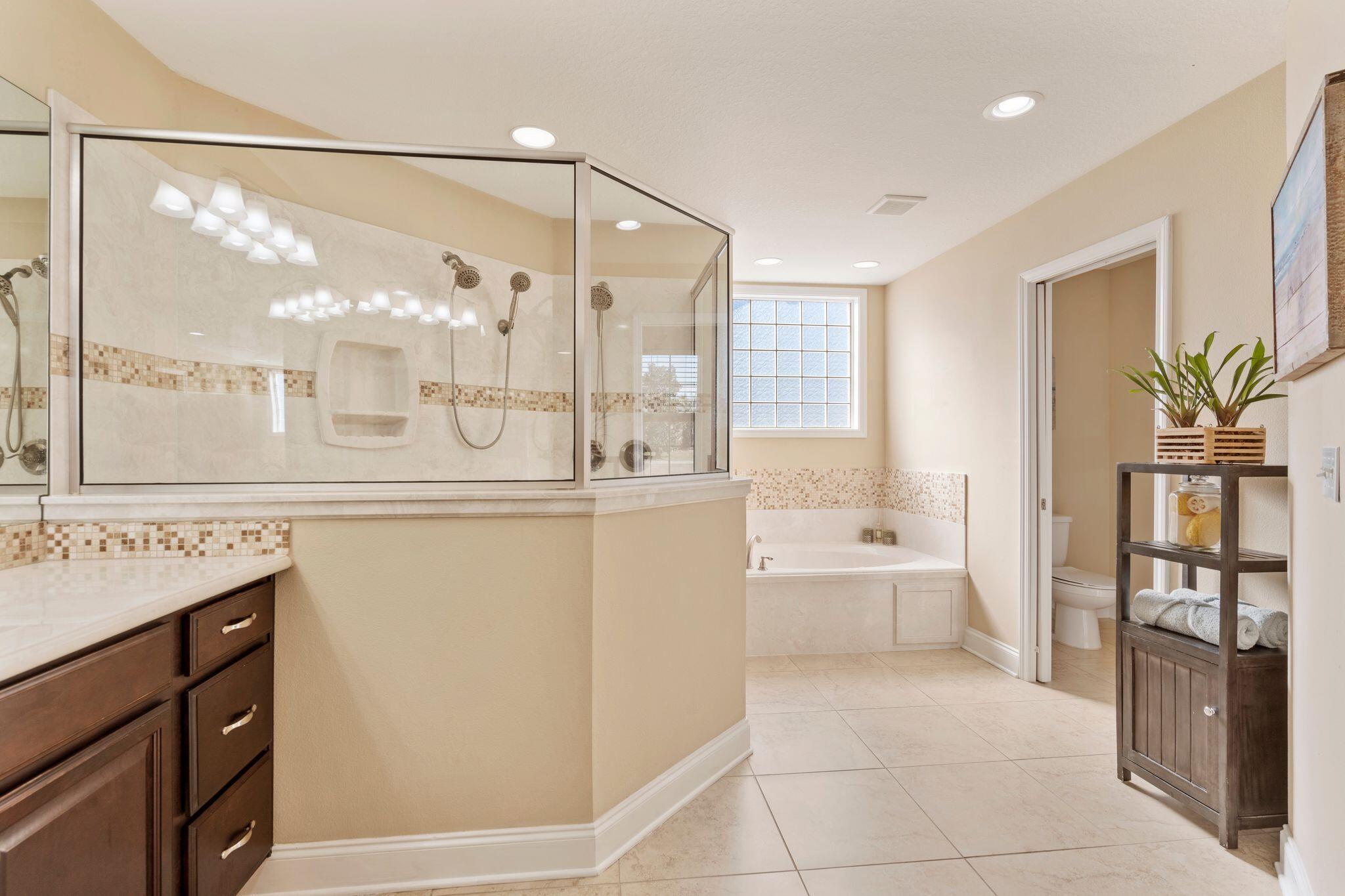 2933 Chancel Avenue Crestview, FL 32539 - Photo 27 of 44 a bathroom with a bathtub shower sink and toilet
