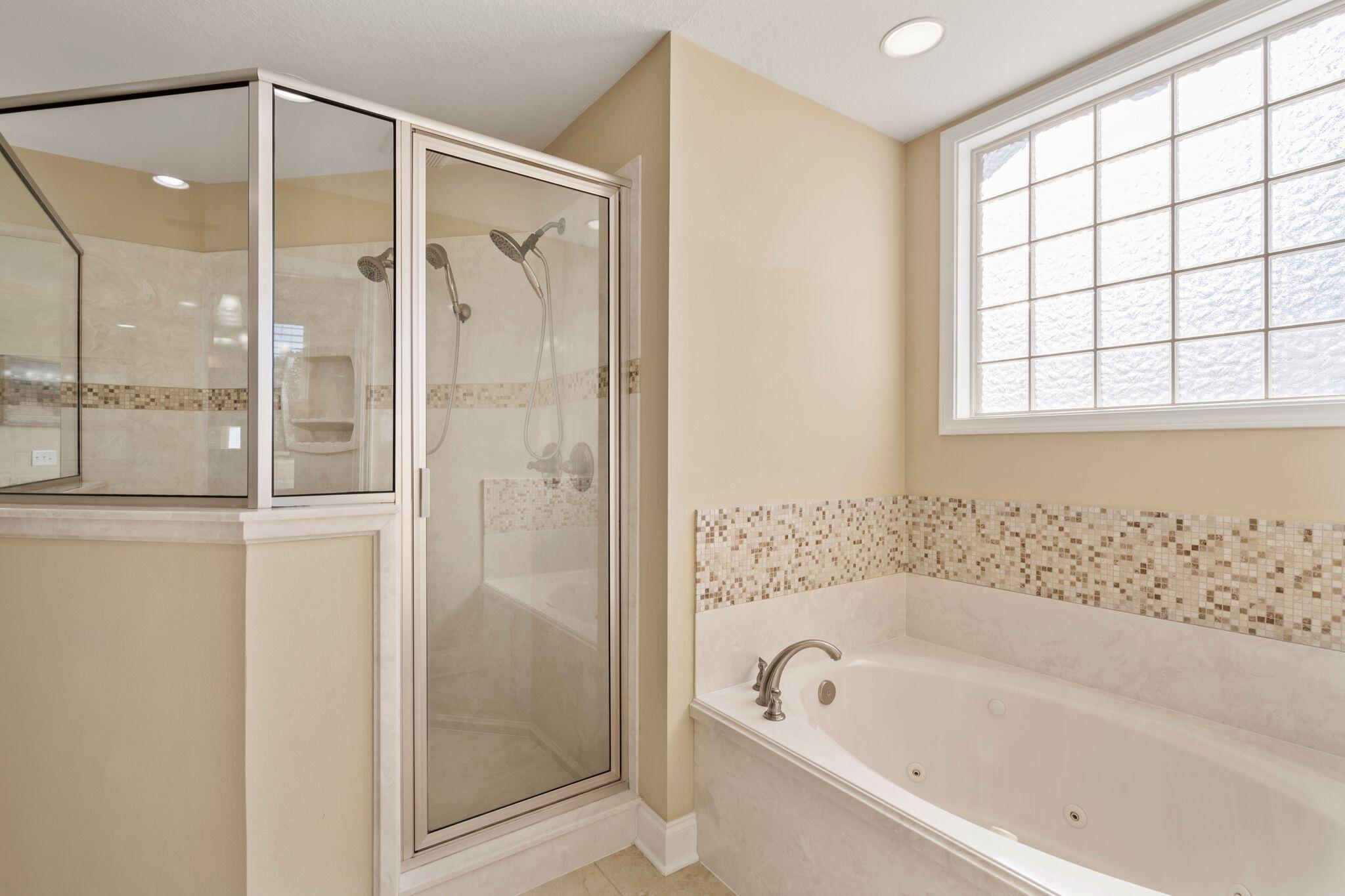 2933 Chancel Avenue Crestview, FL 32539 - Photo 28 of 44 a bathroom with a bathtub and a shower