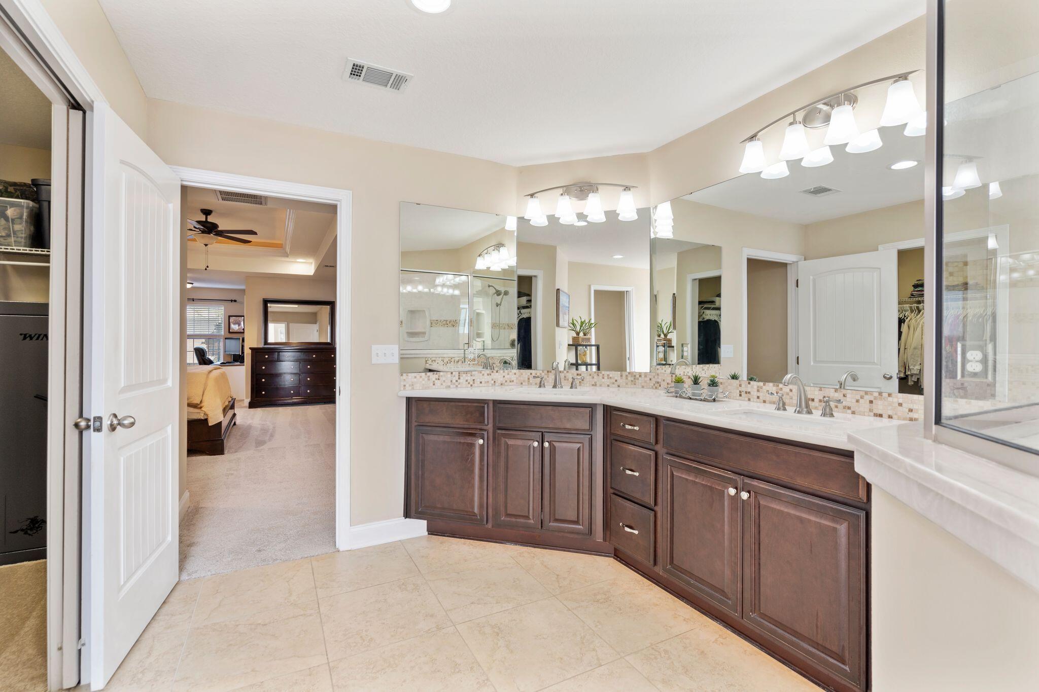 2933 Chancel Avenue Crestview, FL 32539 - Photo 29 of 44 a large bathroom with a large tub and sink