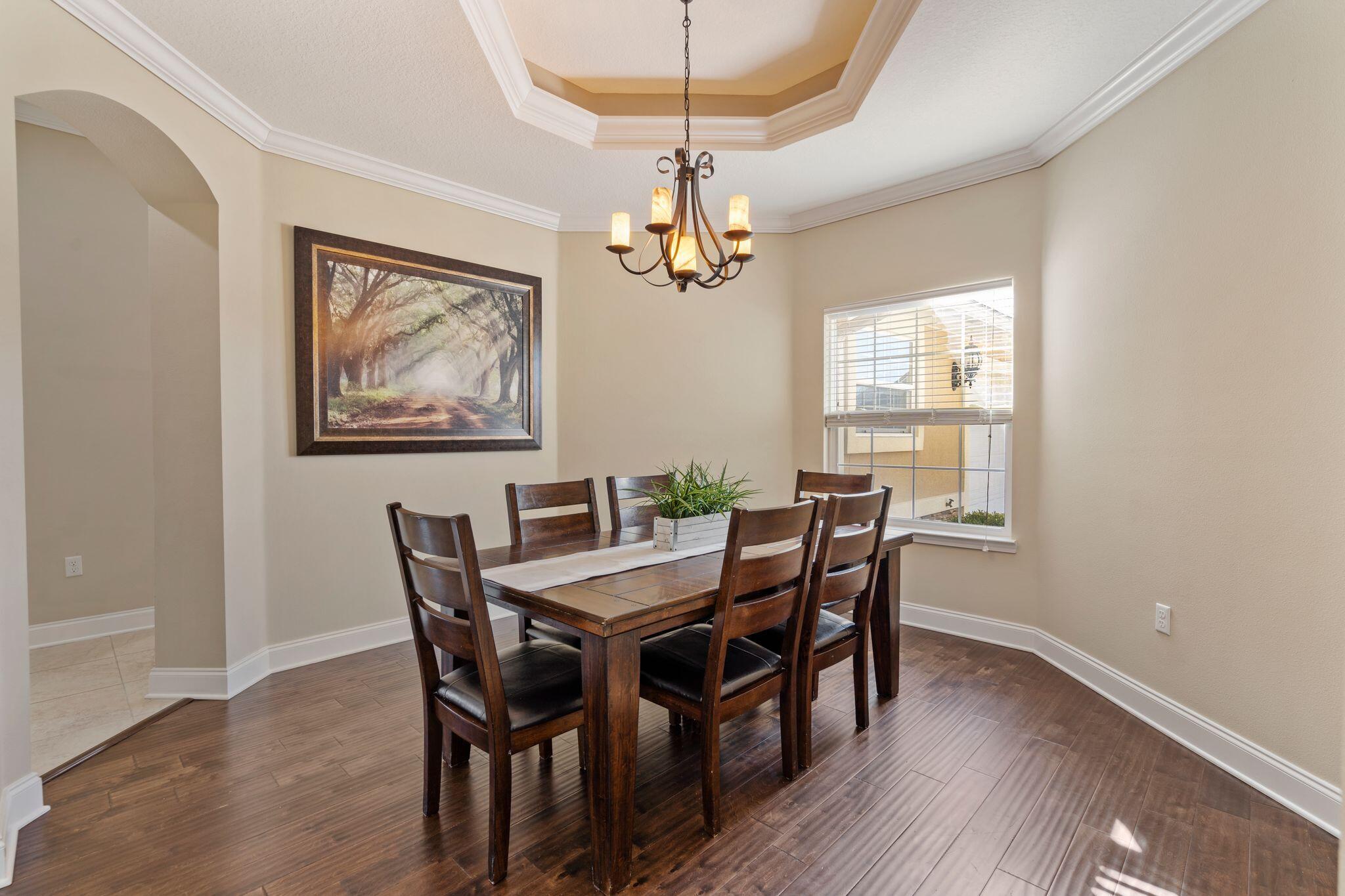2933 Chancel Avenue Crestview, FL 32539 - Photo 3 of 44 a view of a dining room with furniture window and wooden floor