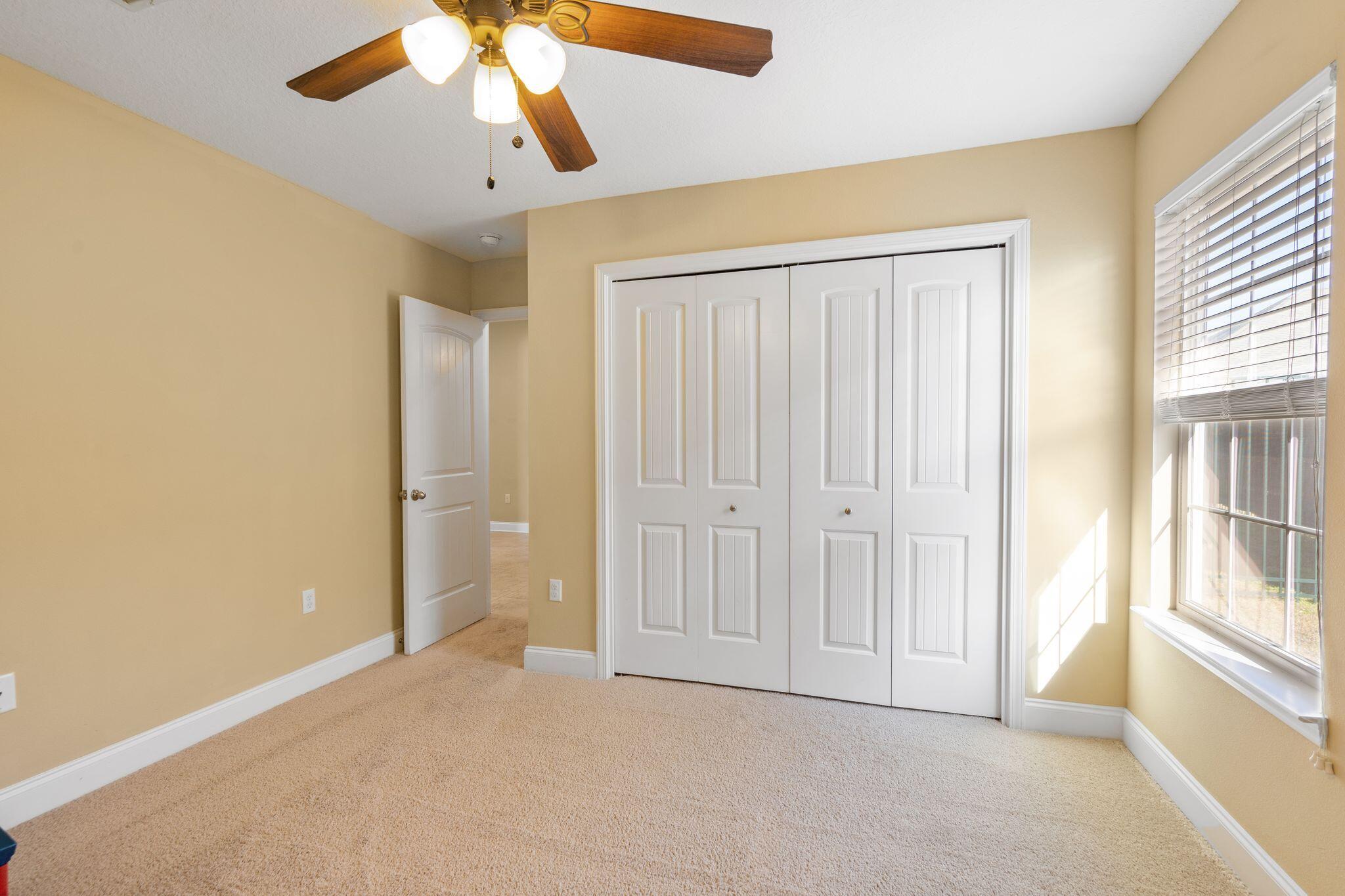 2933 Chancel Avenue Crestview, FL 32539 - Photo 31 of 44 a view of an empty room with a window