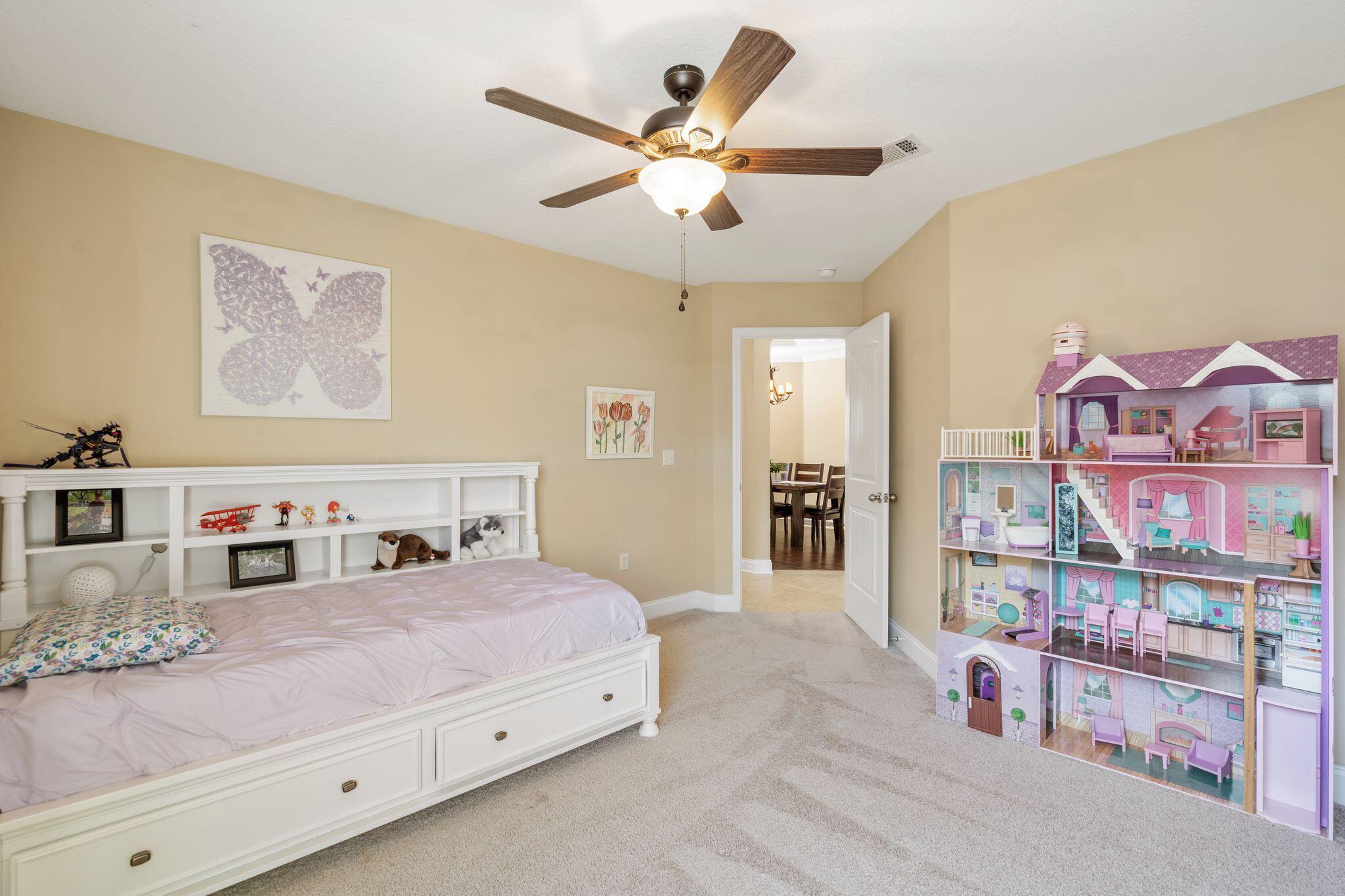 2933 Chancel Avenue Crestview, FL 32539 - Photo 33 of 44 a bedroom with a bed and a book shelf