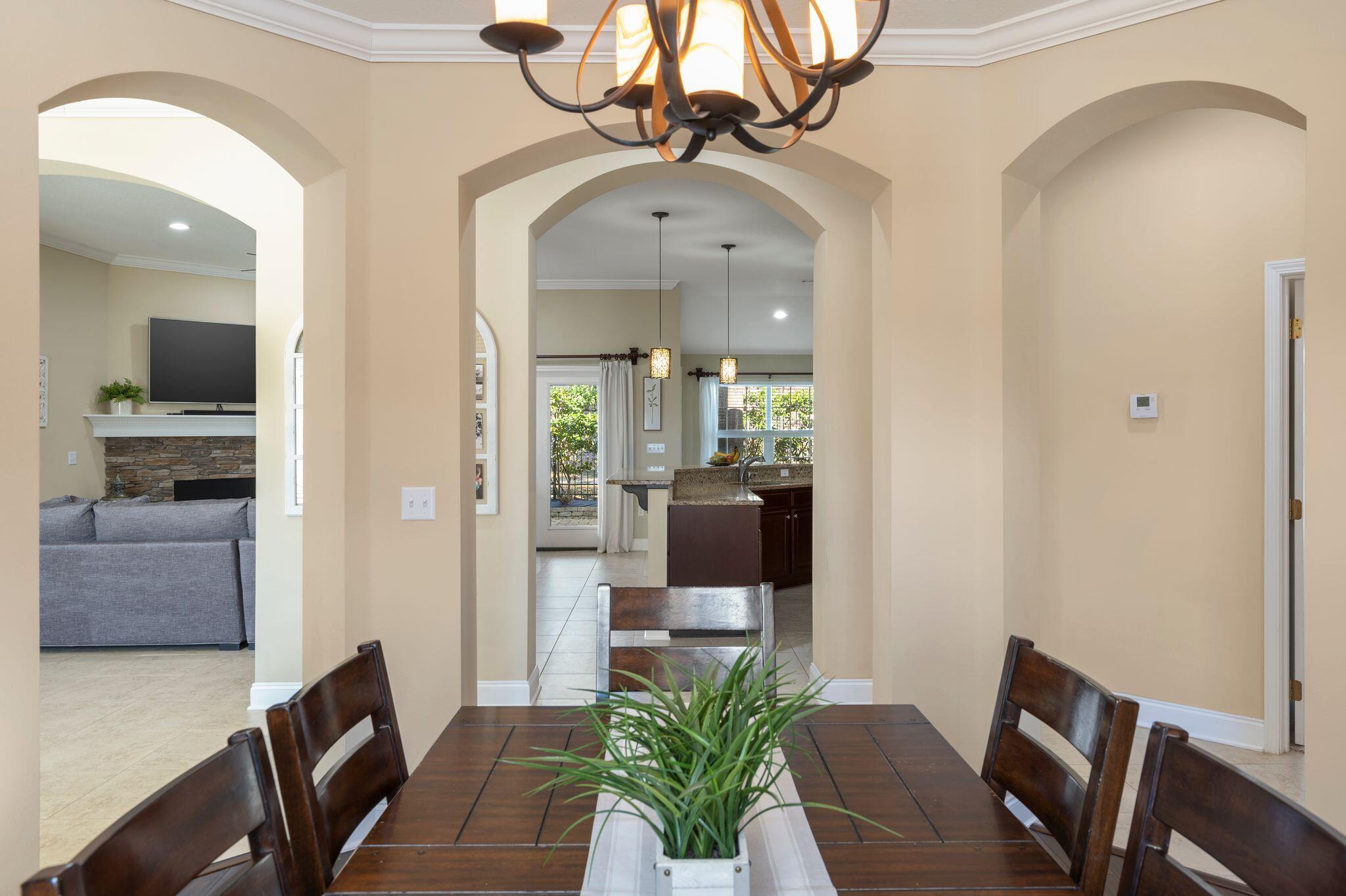 2933 Chancel Avenue Crestview, FL 32539 - Photo 5 of 44 a living room with furniture and a chandelier