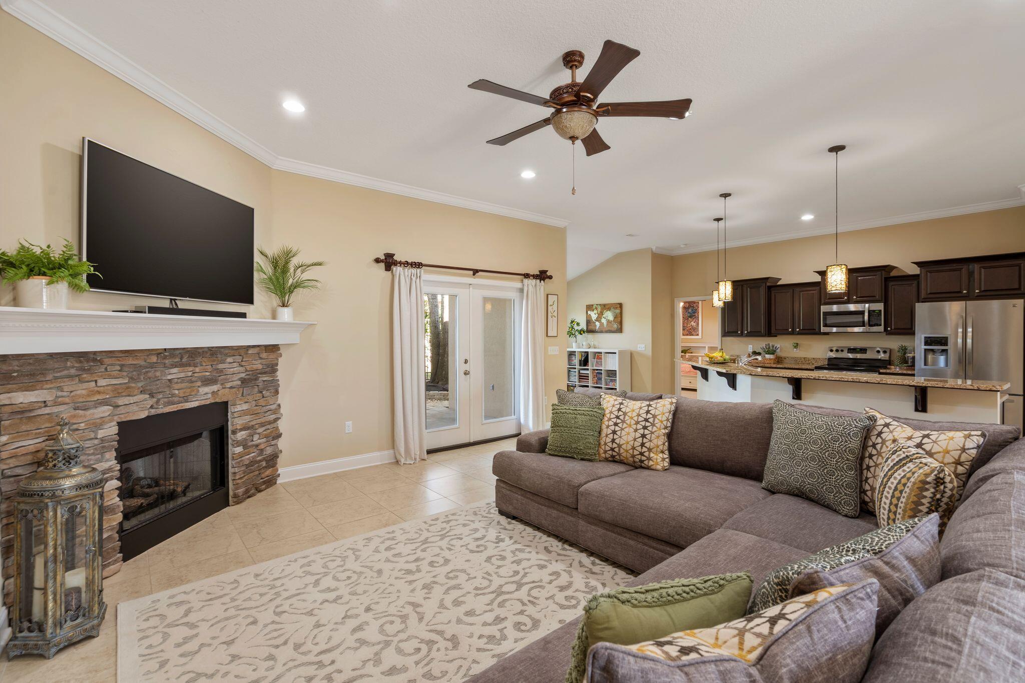 2933 Chancel Avenue Crestview, FL 32539 - Photo 6 of 44 a living room with furniture fireplace and flat screen tv