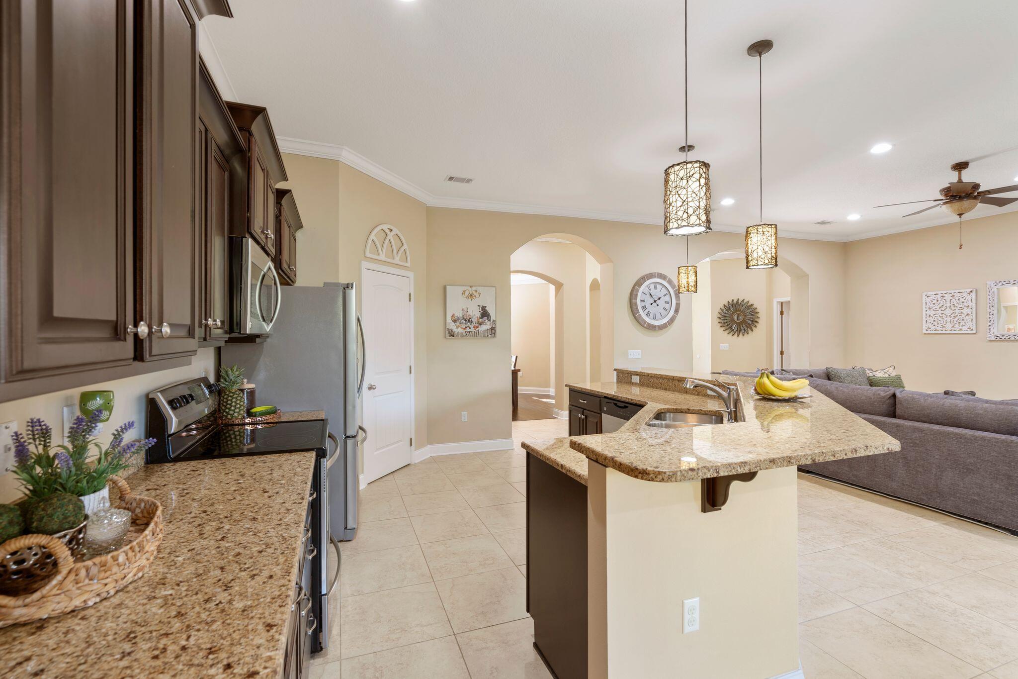 2933 Chancel Avenue Crestview, FL 32539 - Photo 10 of 44 a very nice looking dining room with a table chairs and chandelier