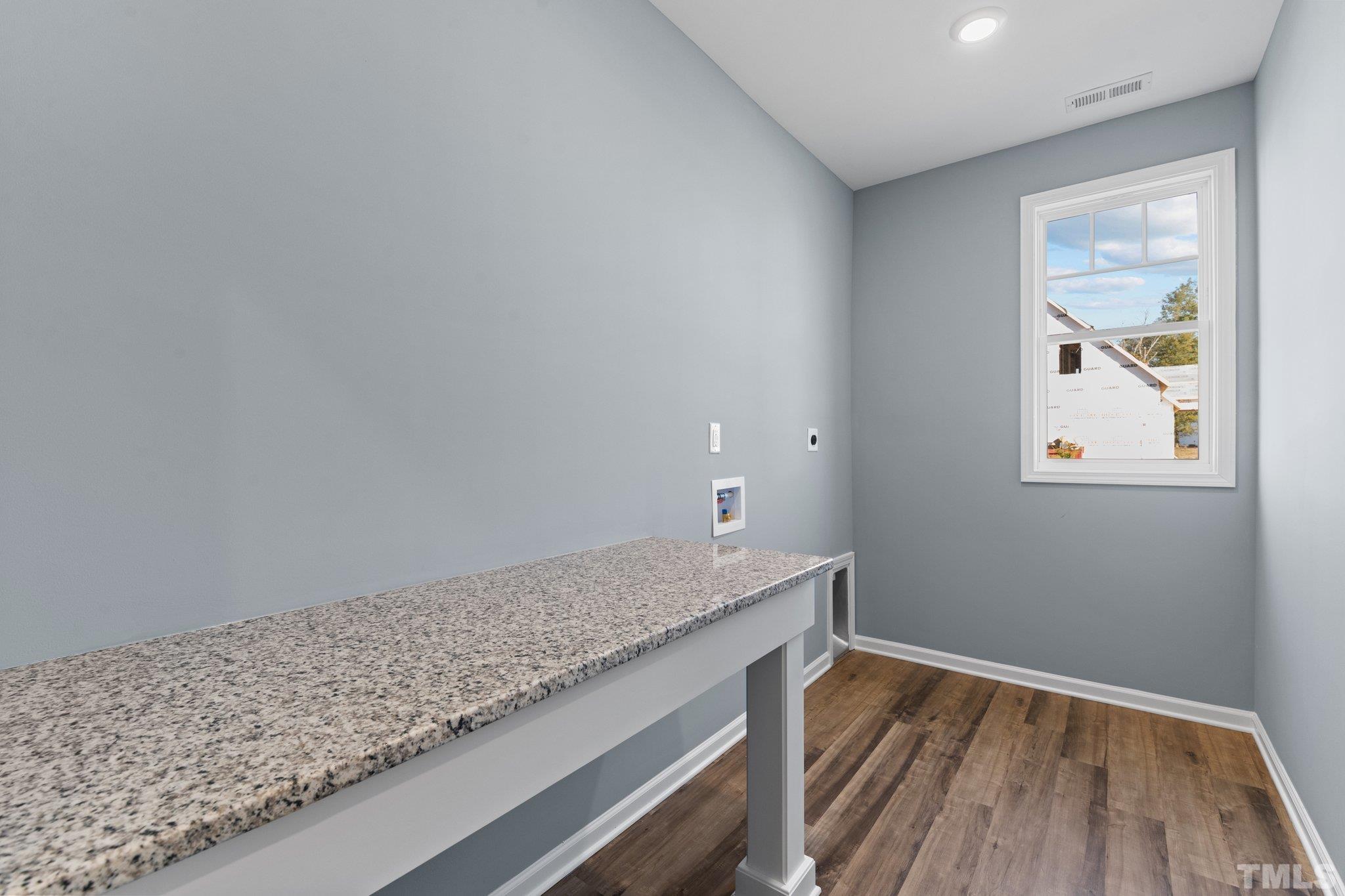 9655 Chapman Road Bailey, NC 27807 - Photo 13 of 33 a view of room with window and wooden floor