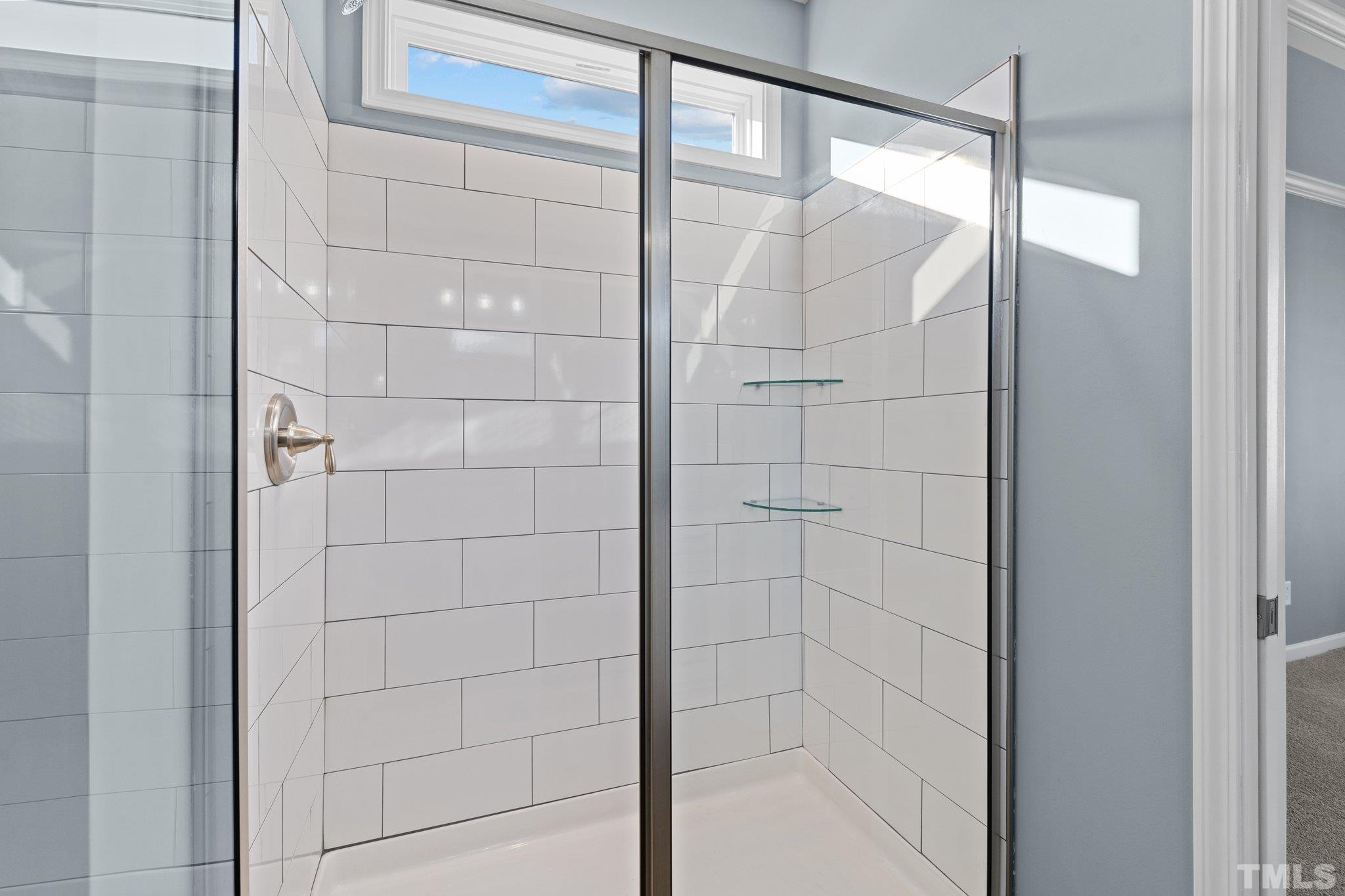 9655 Chapman Road Bailey, NC 27807 - Photo 16 of 33 a bathroom with a glass shower door