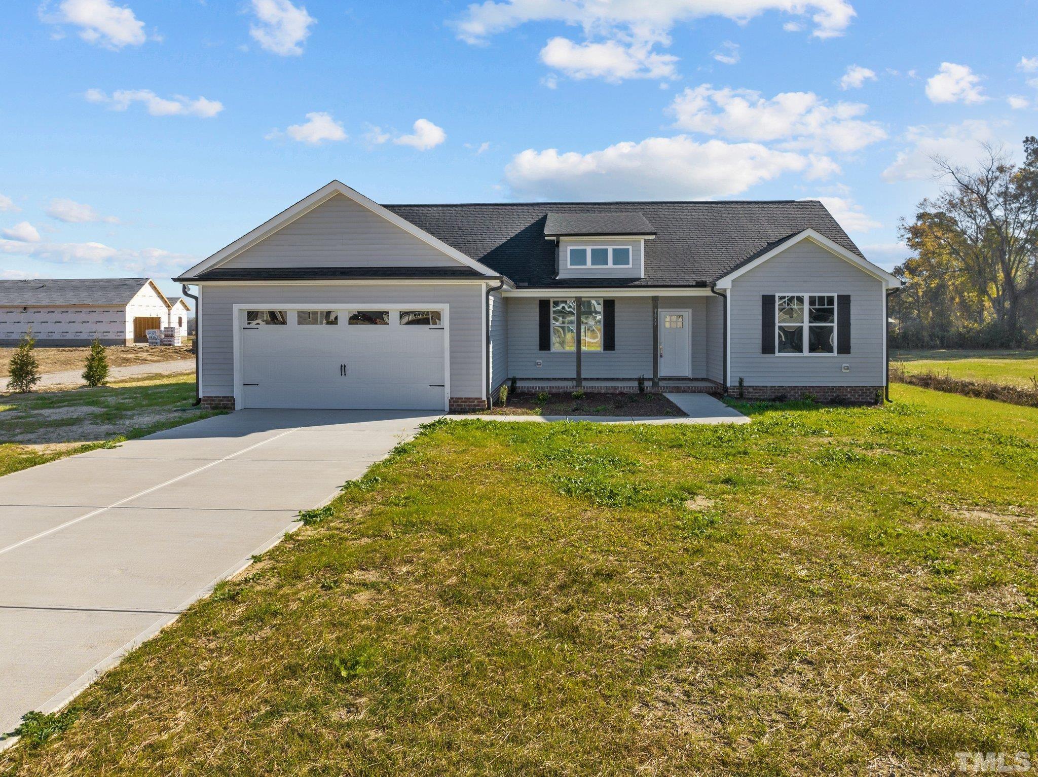 9655 Chapman Road Bailey, NC 27807 - Photo 2 of 33 a house view with a garden space