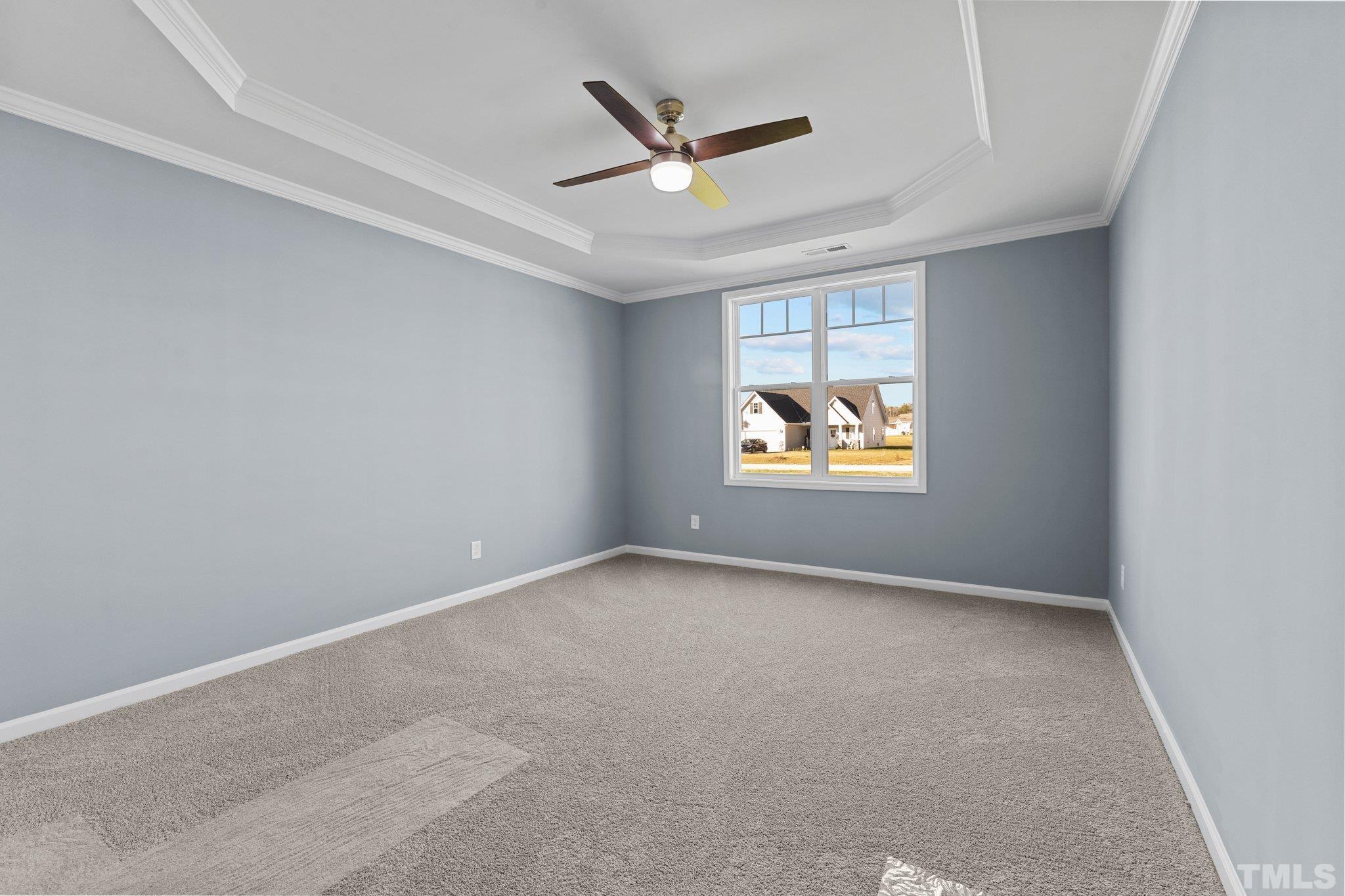 9655 Chapman Road Bailey, NC 27807 - Photo 21 of 33 an empty room with window and ceiling fan