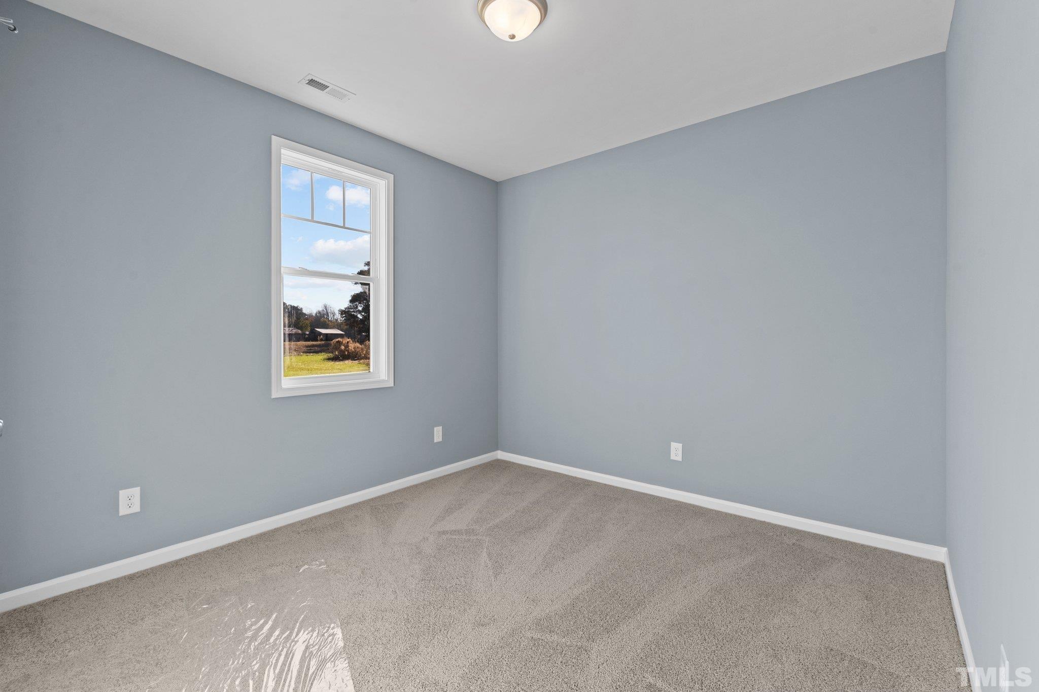 9655 Chapman Road Bailey, NC 27807 - Photo 27 of 33 an empty room with windows and fan