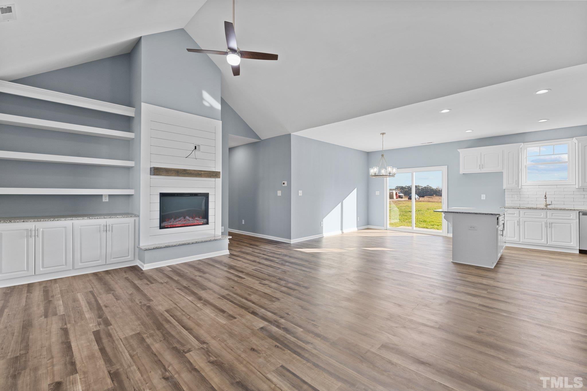 9655 Chapman Road Bailey, NC 27807 - Photo 7 of 33 a view of empty room with wooden floor and fireplace