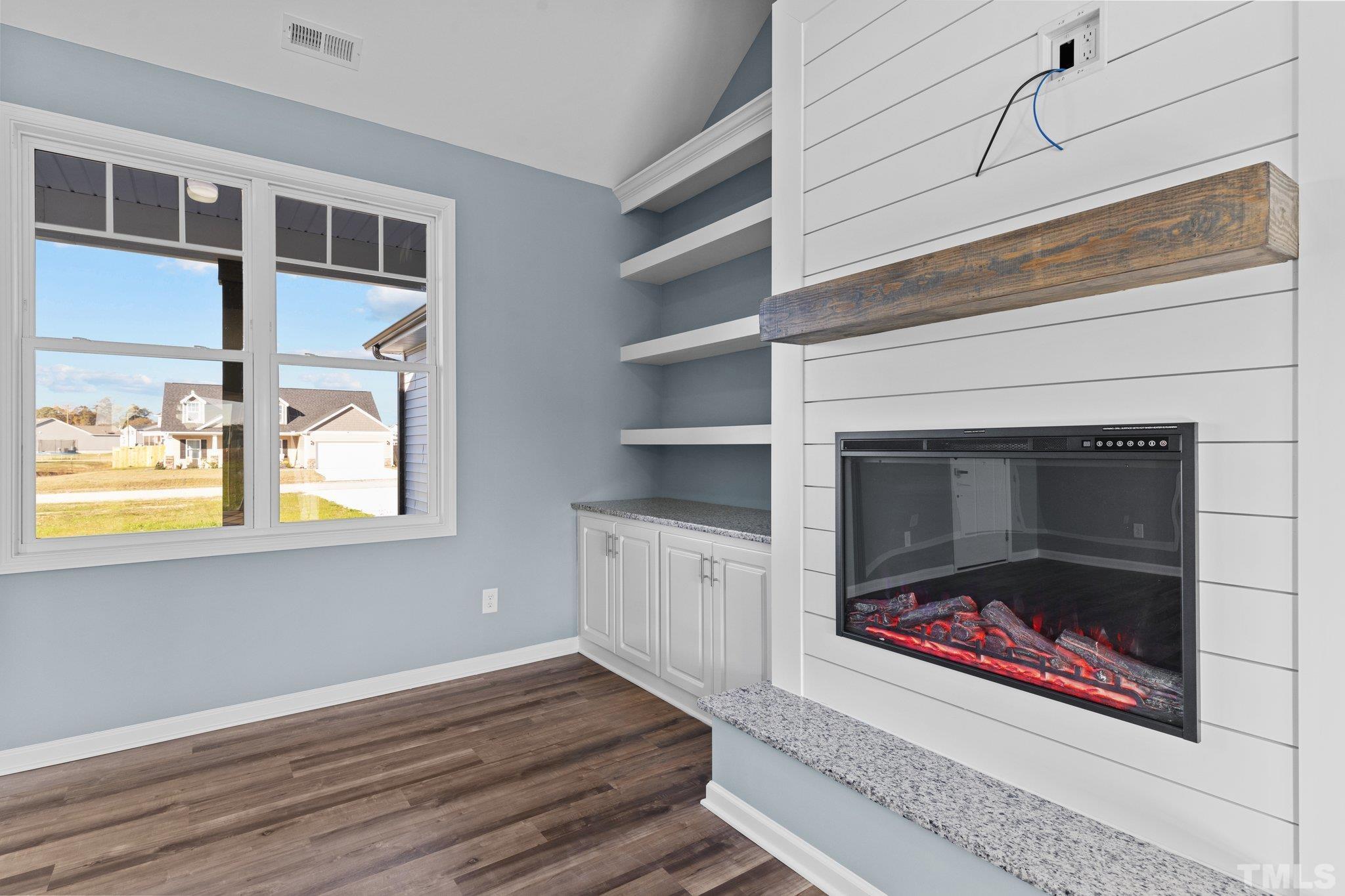 9655 Chapman Road Bailey, NC 27807 - Photo 8 of 33 a living room with furniture and a fireplace