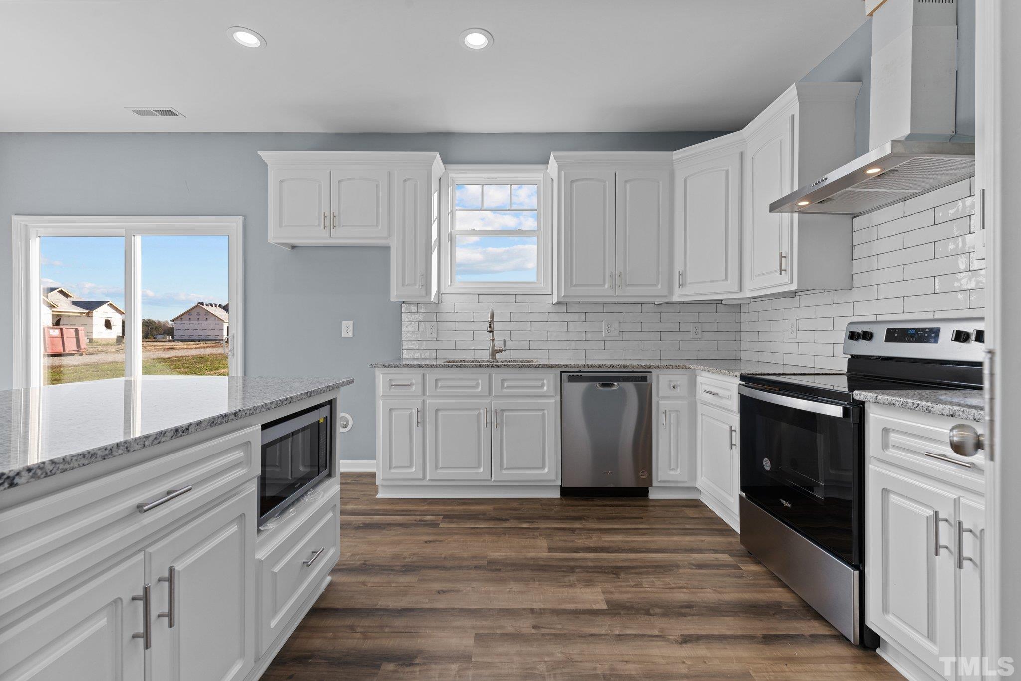 9655 Chapman Road Bailey, NC 27807 - Photo 10 of 33 a kitchen with stainless steel appliances granite countertop a stove and a sink