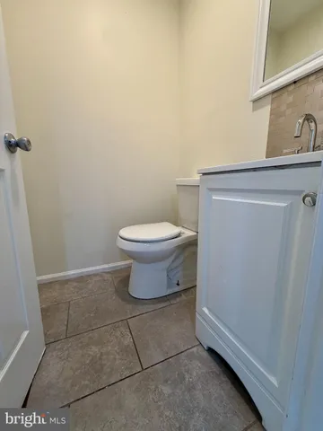 a bathroom with a toilet and a sink