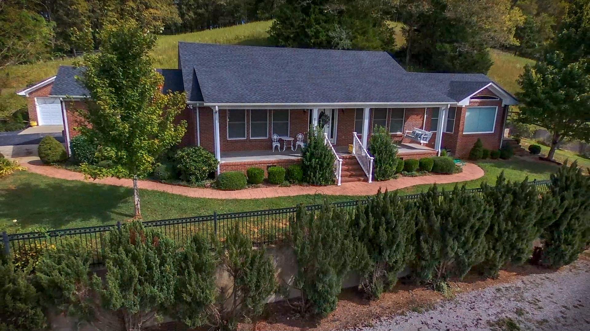 439 Agnew Road Pulaski, TN 38478 - Photo 1 of 30 a front view of a house with garden