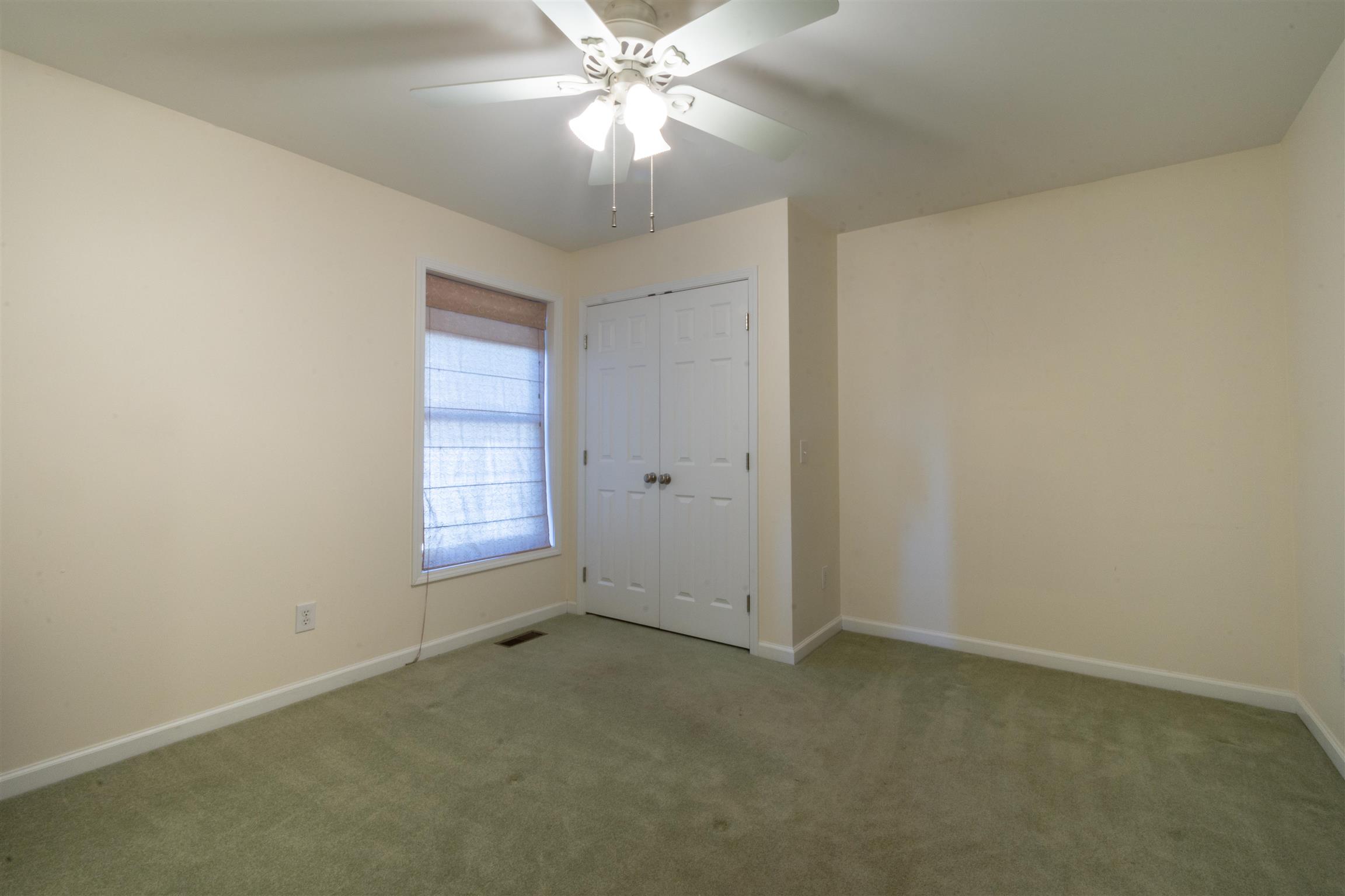 439 Agnew Road Pulaski, TN 38478 - Photo 16 of 30 an empty room with a fan and a window