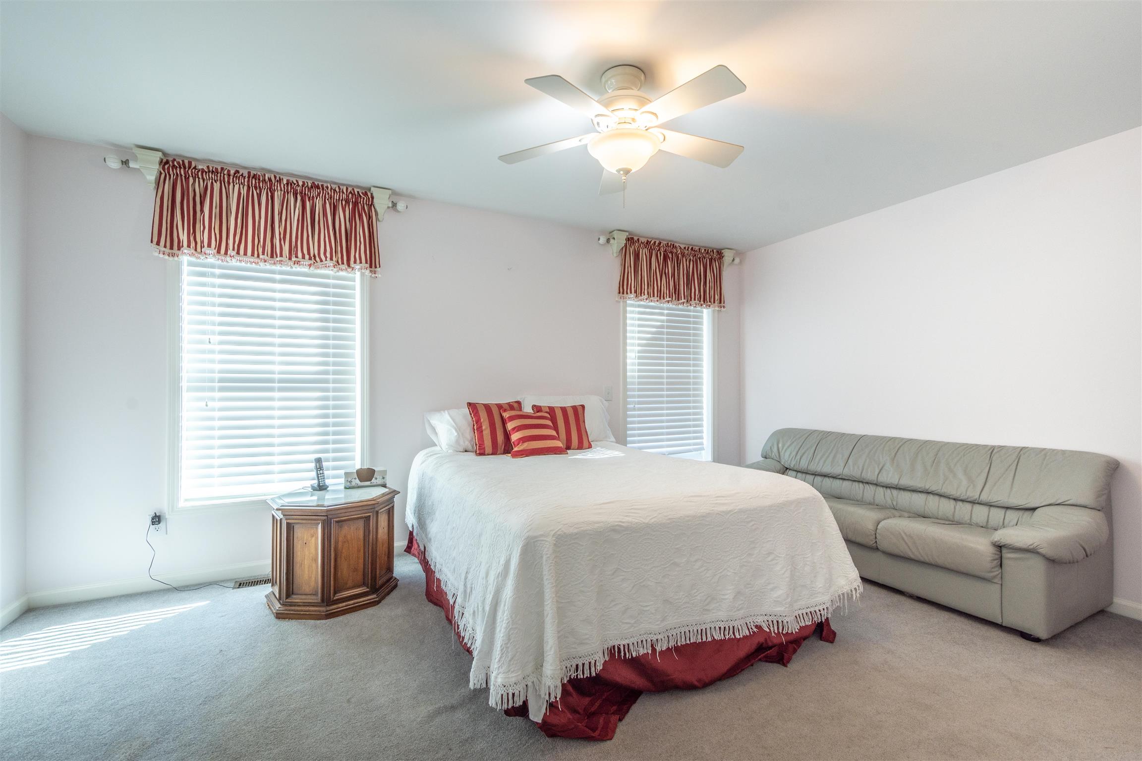 439 Agnew Road Pulaski, TN 38478 - Photo 19 of 30 a bedroom with a bed furniture and a chandelier