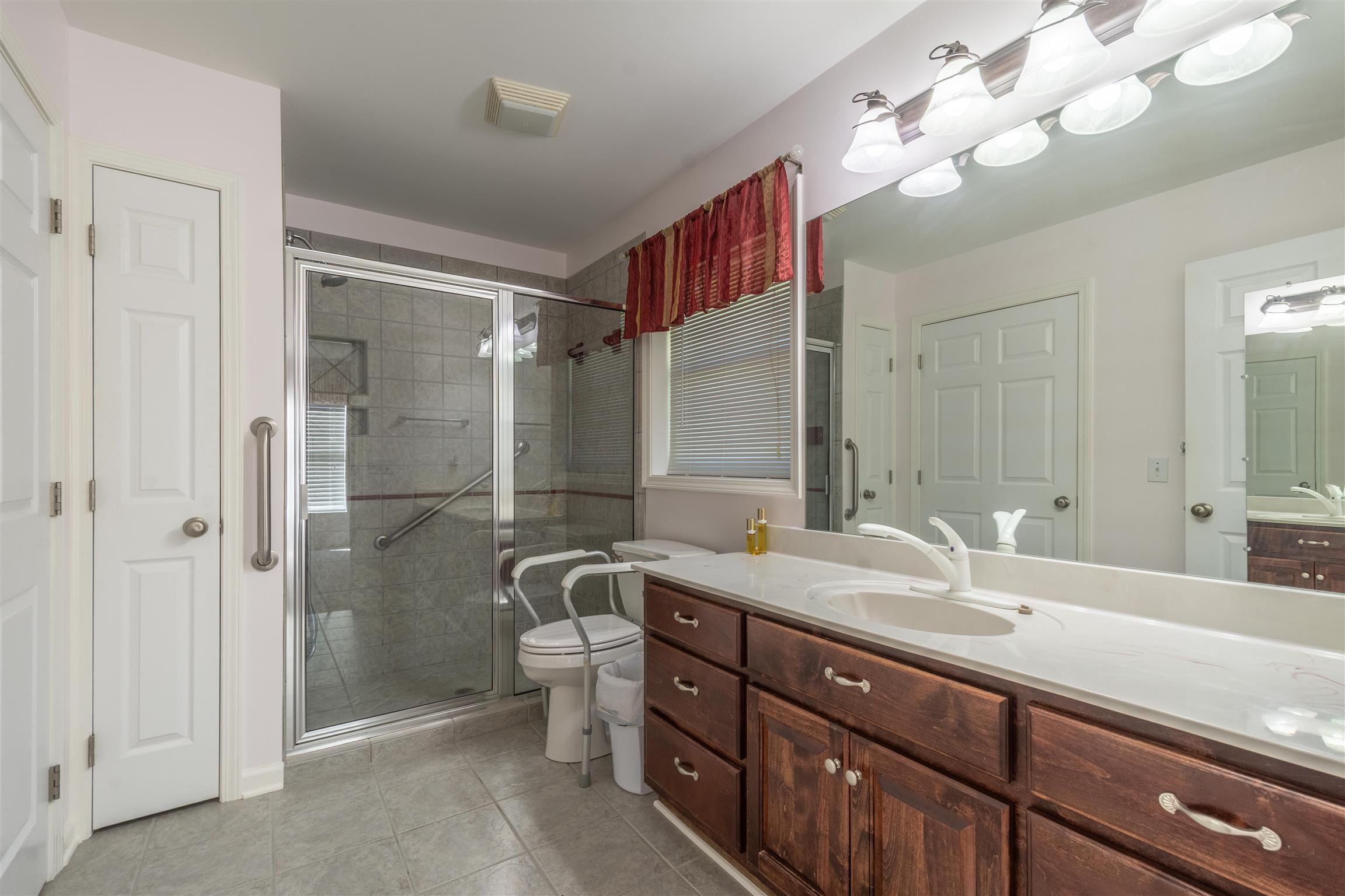 439 Agnew Road Pulaski, TN 38478 - Photo 20 of 30 a bathroom with a double vanity sink mirror and shower