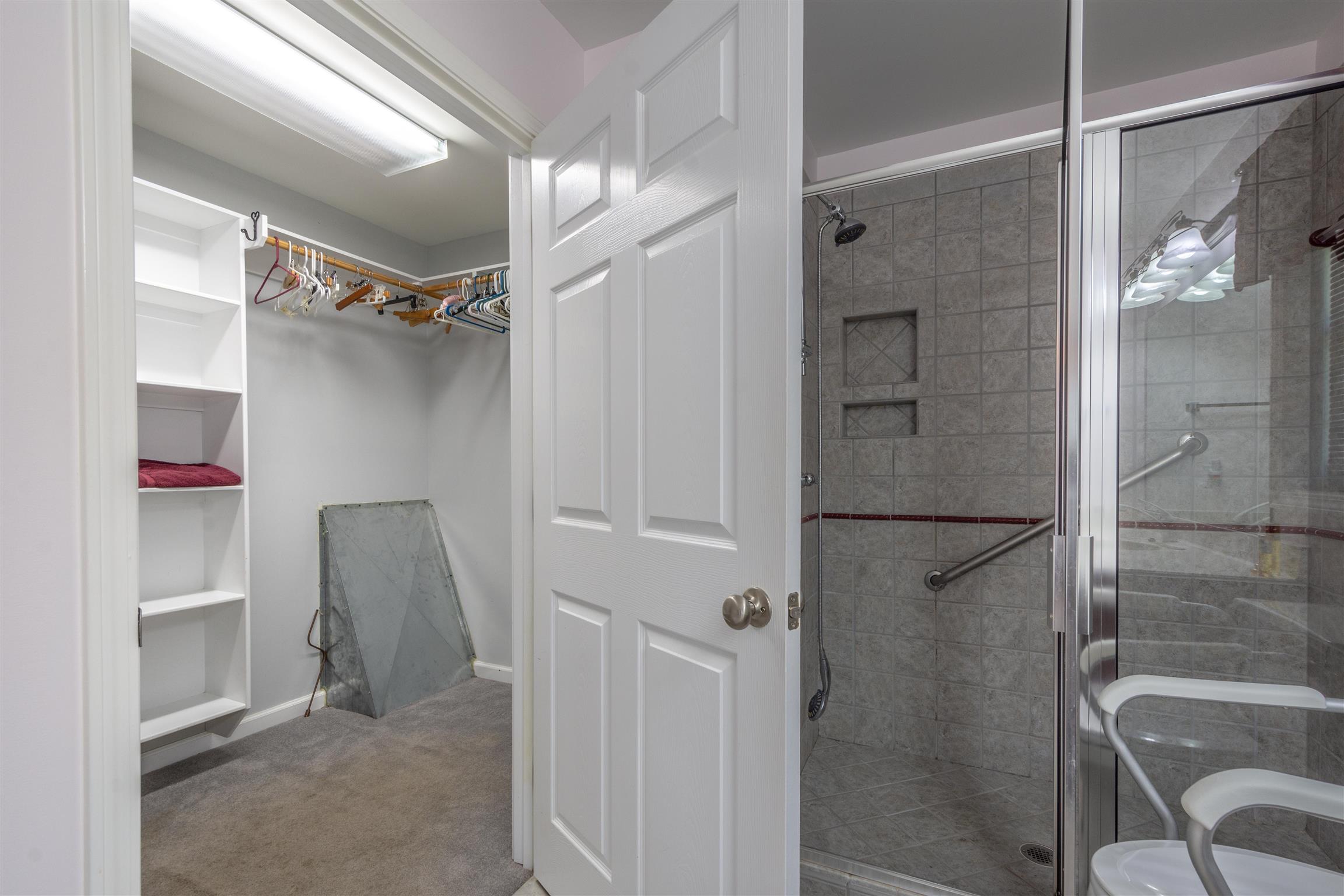 439 Agnew Road Pulaski, TN 38478 - Photo 21 of 30 a bathroom with a glass shower door and a sink