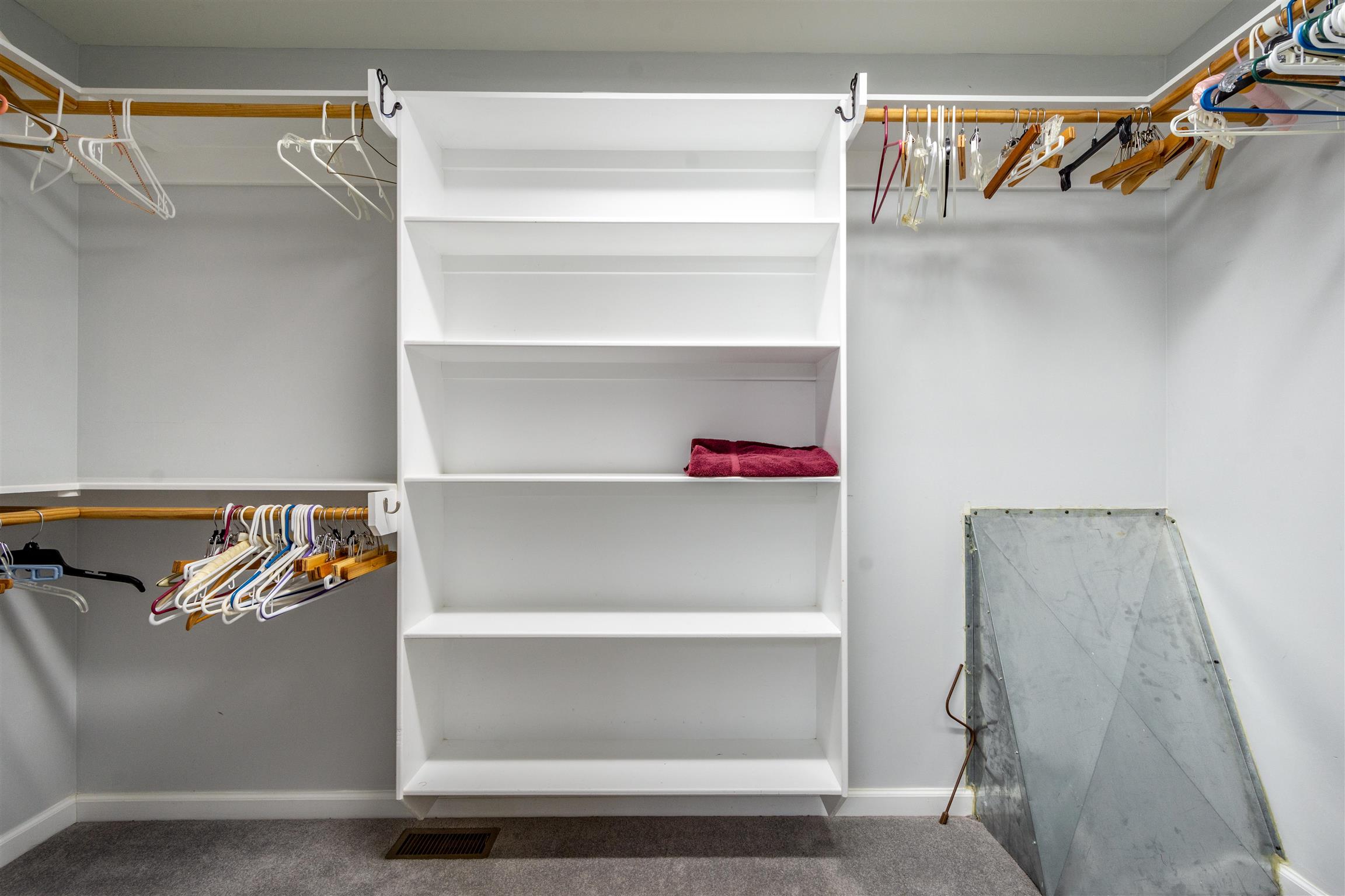439 Agnew Road Pulaski, TN 38478 - Photo 22 of 30 a view of walk in closet with clothes and shoes