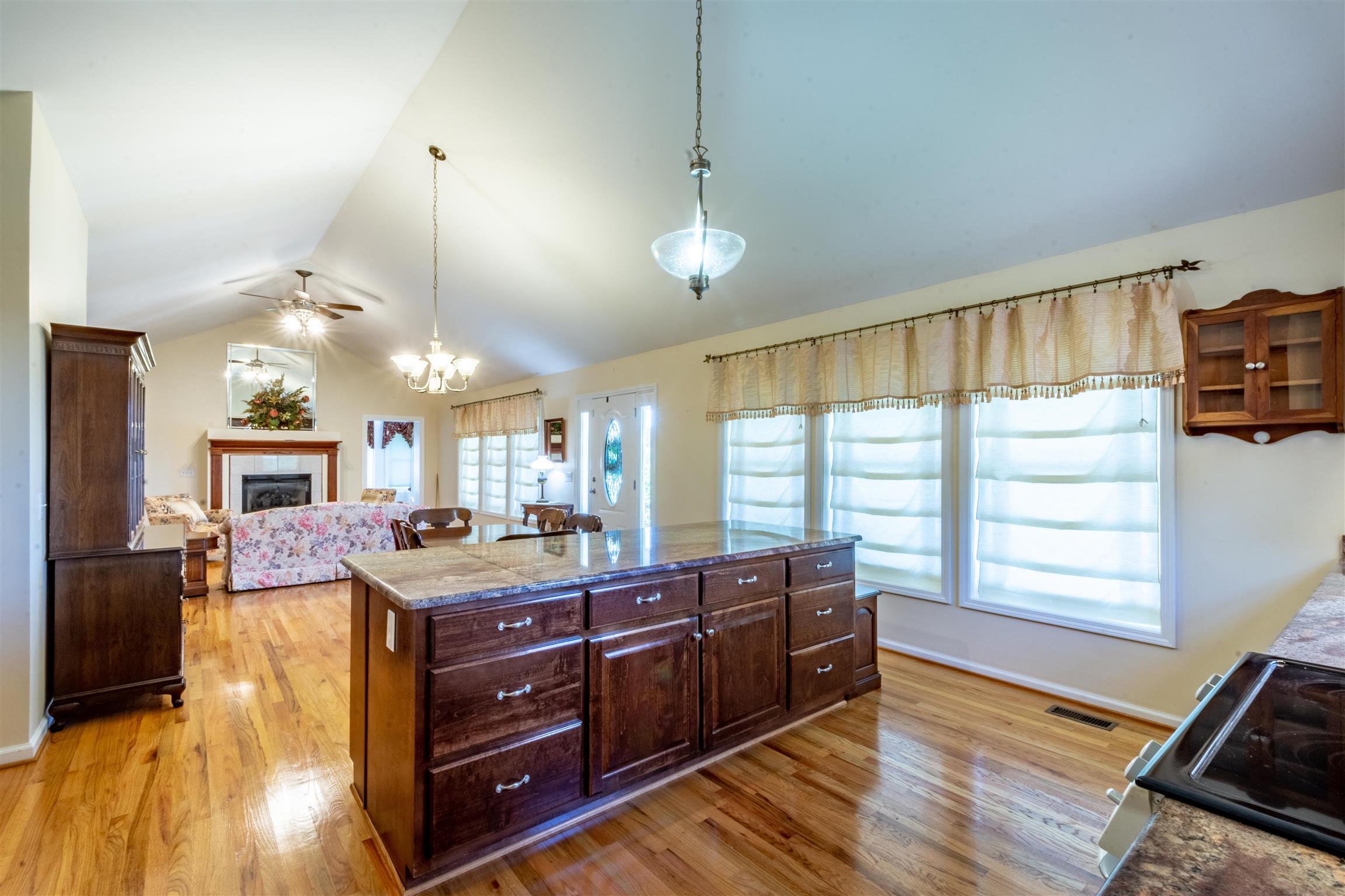 439 Agnew Road Pulaski, TN 38478 - Photo 7 of 30 a kitchen with a stove a counter space a sink and a window