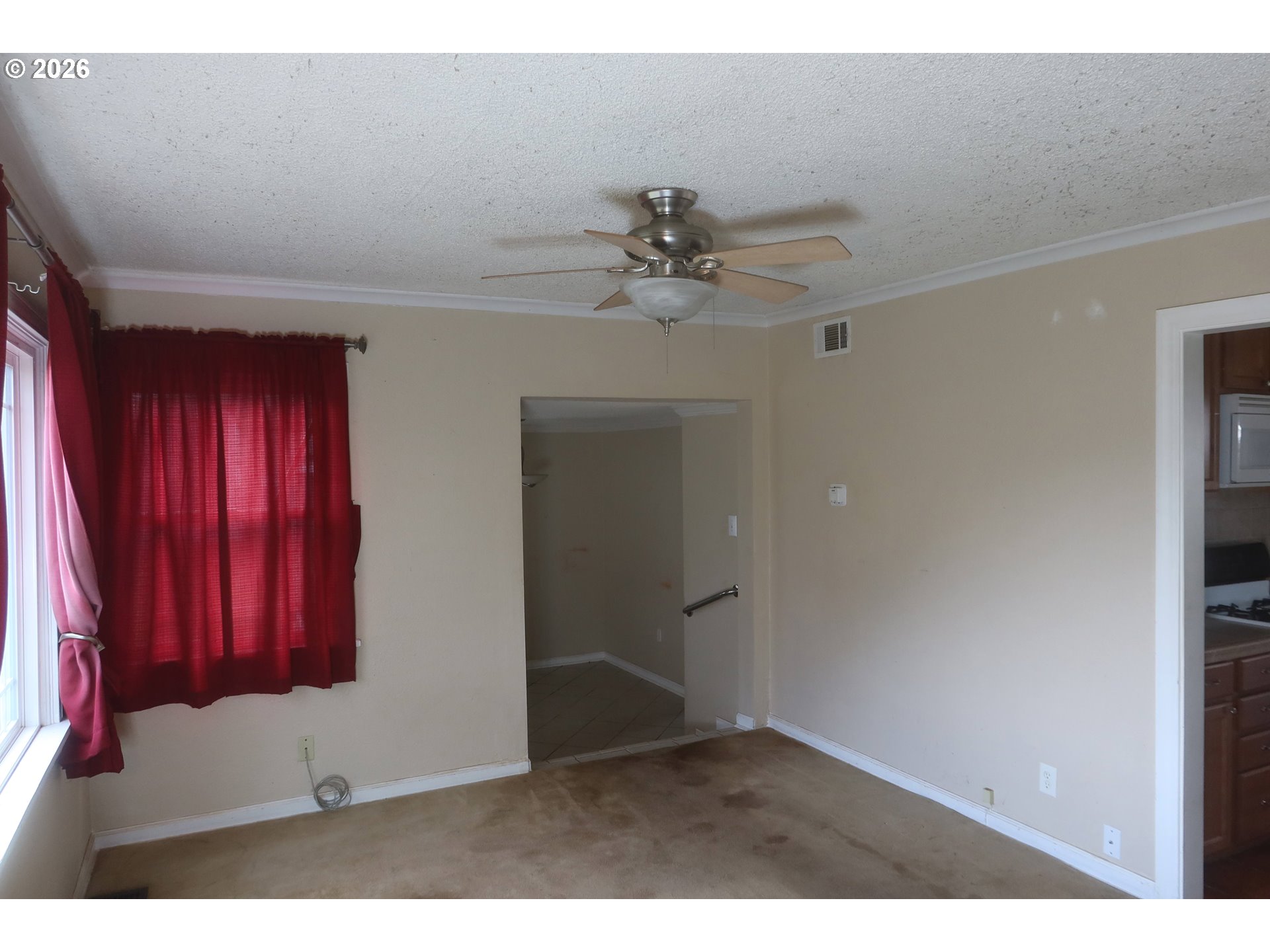 138 Maple Boulevard Wood Village, OR 97060 - Photo 4 of 15 an empty room with windows and cabinet