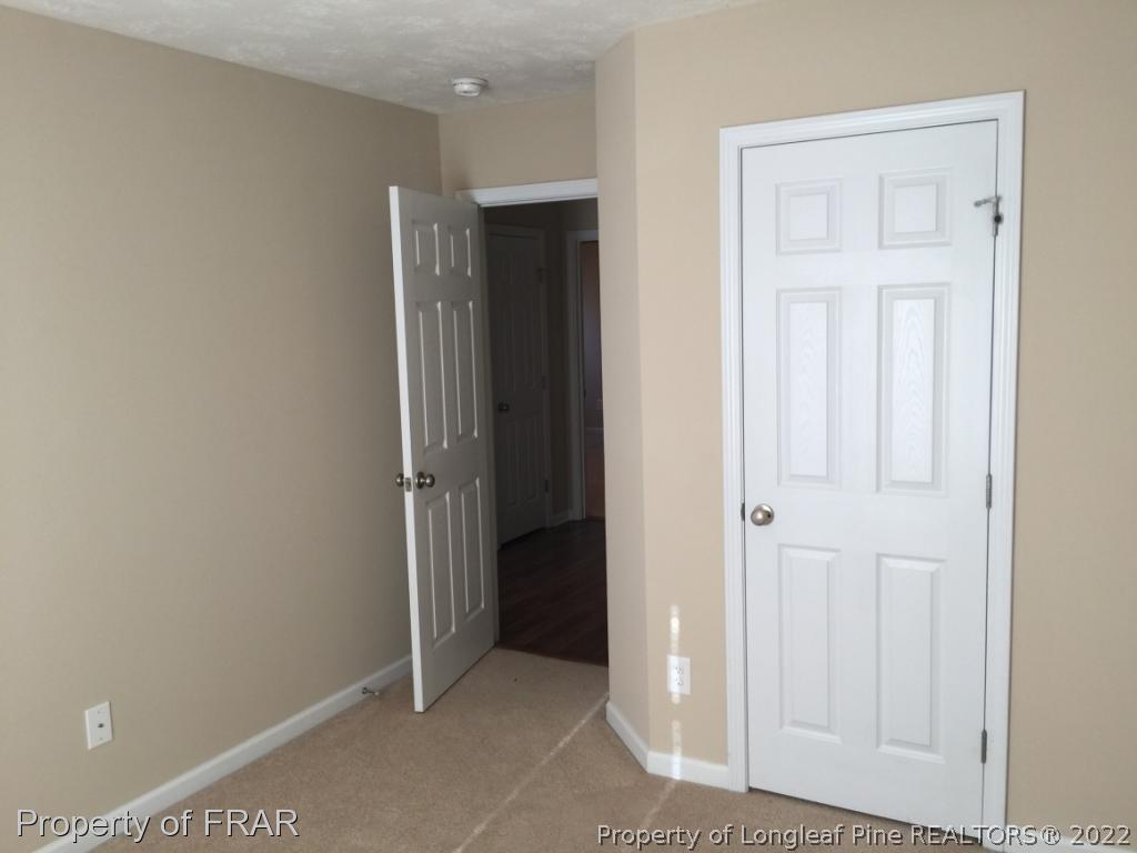 535 Cape Fear Road Raeford, NC 28376 - Photo 14 of 27 an empty room with closet and a bathroom