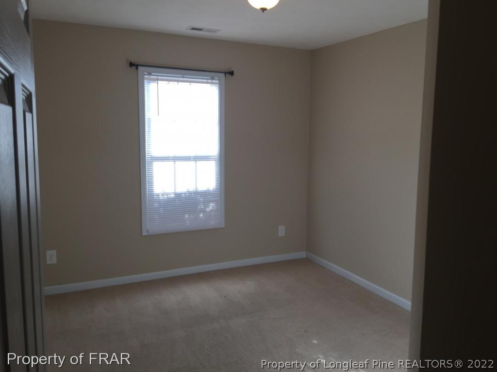 535 Cape Fear Road Raeford, NC 28376 - Photo 15 of 27 an empty room with a window