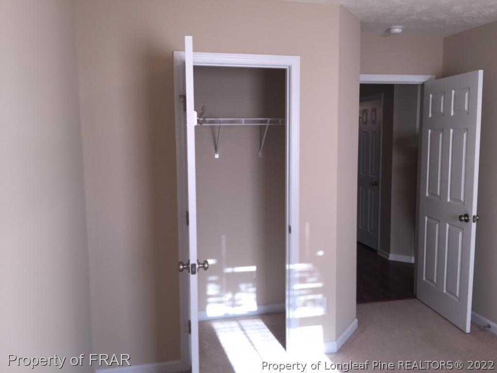 535 Cape Fear Road Raeford, NC 28376 - Photo 16 of 27 a view of a hallway with wooden floor and closet