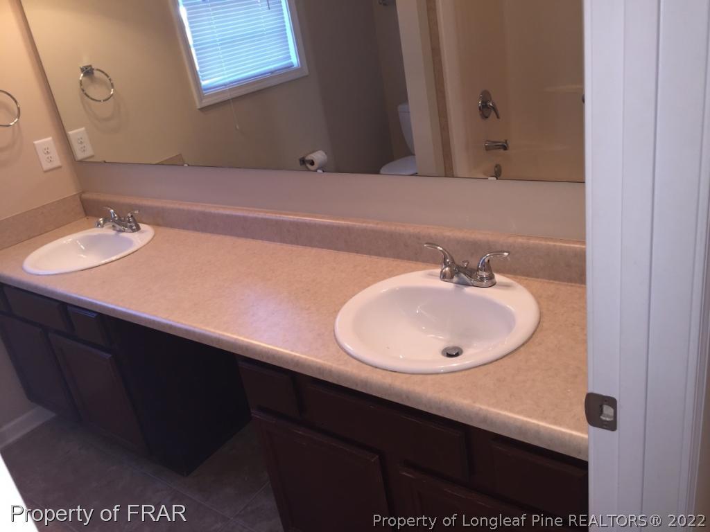 535 Cape Fear Road Raeford, NC 28376 - Photo 20 of 27 a bathroom with a sink and a mirror