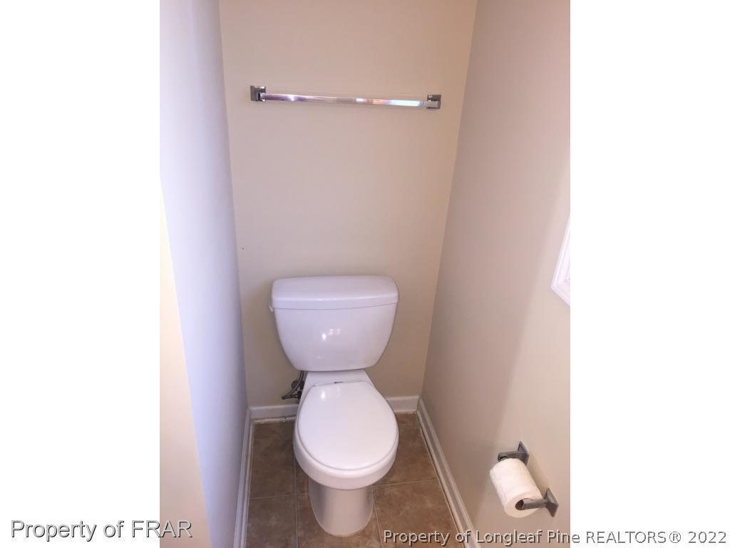 535 Cape Fear Road Raeford, NC 28376 - Photo 21 of 27 a bathroom with a toilet and a sink
