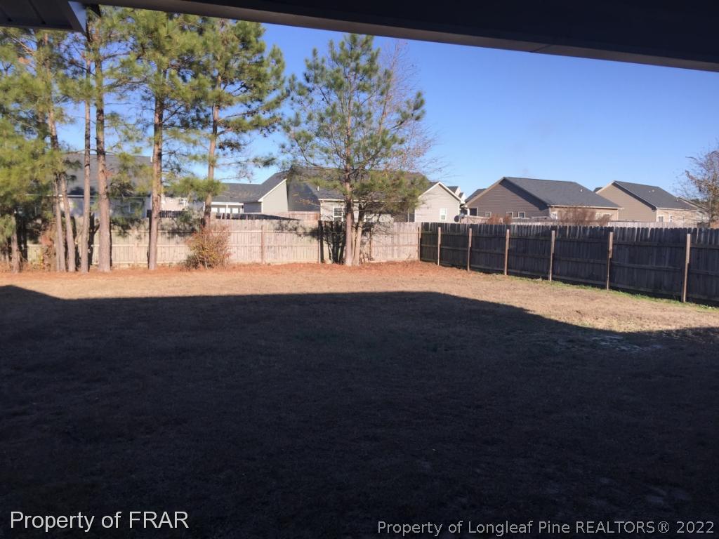 535 Cape Fear Road Raeford, NC 28376 - Photo 25 of 27 a view of a house with a yard