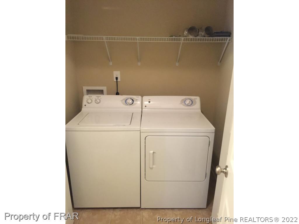 535 Cape Fear Road Raeford, NC 28376 - Photo 7 of 27 a utility room with dryer and washer