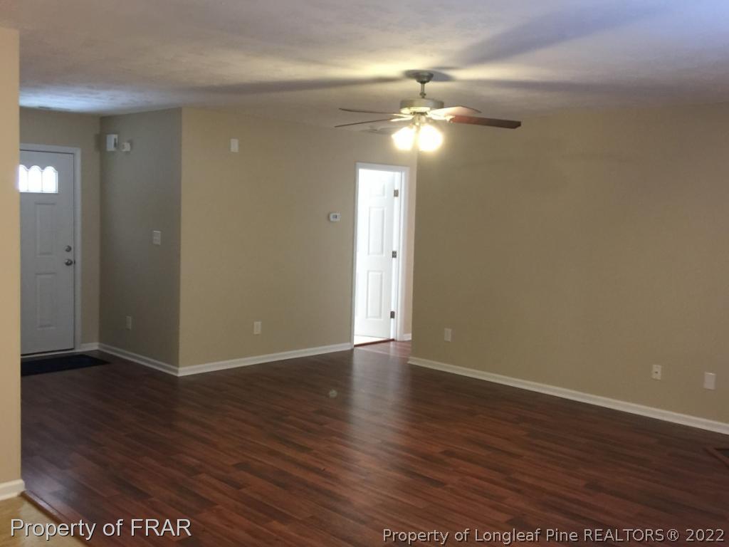 535 Cape Fear Road Raeford, NC 28376 - Photo 10 of 27 a view of an empty room with wooden floor