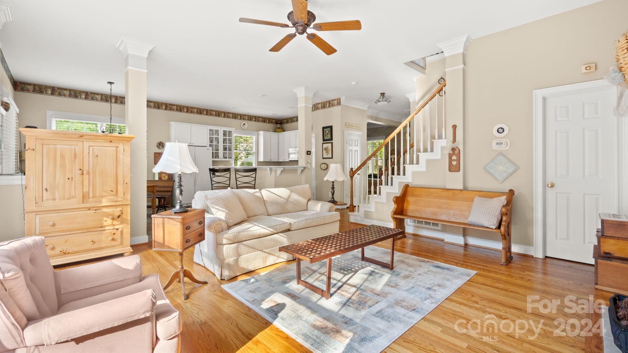 7121 Michael Scott Crossing Fort Mill, SC 29708 - Photo 14 of 46 a living room with furniture and a wooden floor