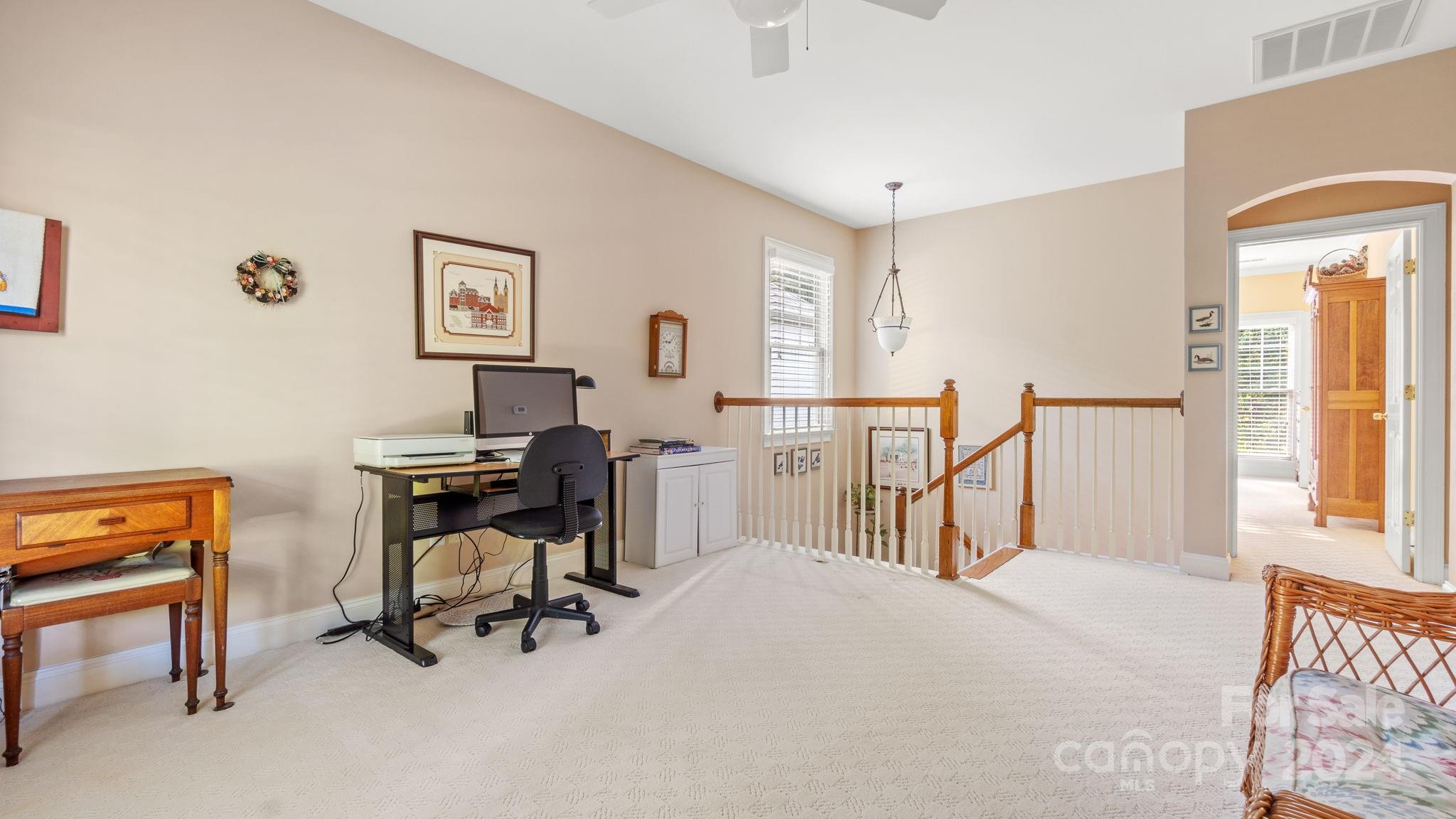 7121 Michael Scott Crossing Fort Mill, SC 29708 - Photo 22 of 46 a view of a workspace with furniture and a window