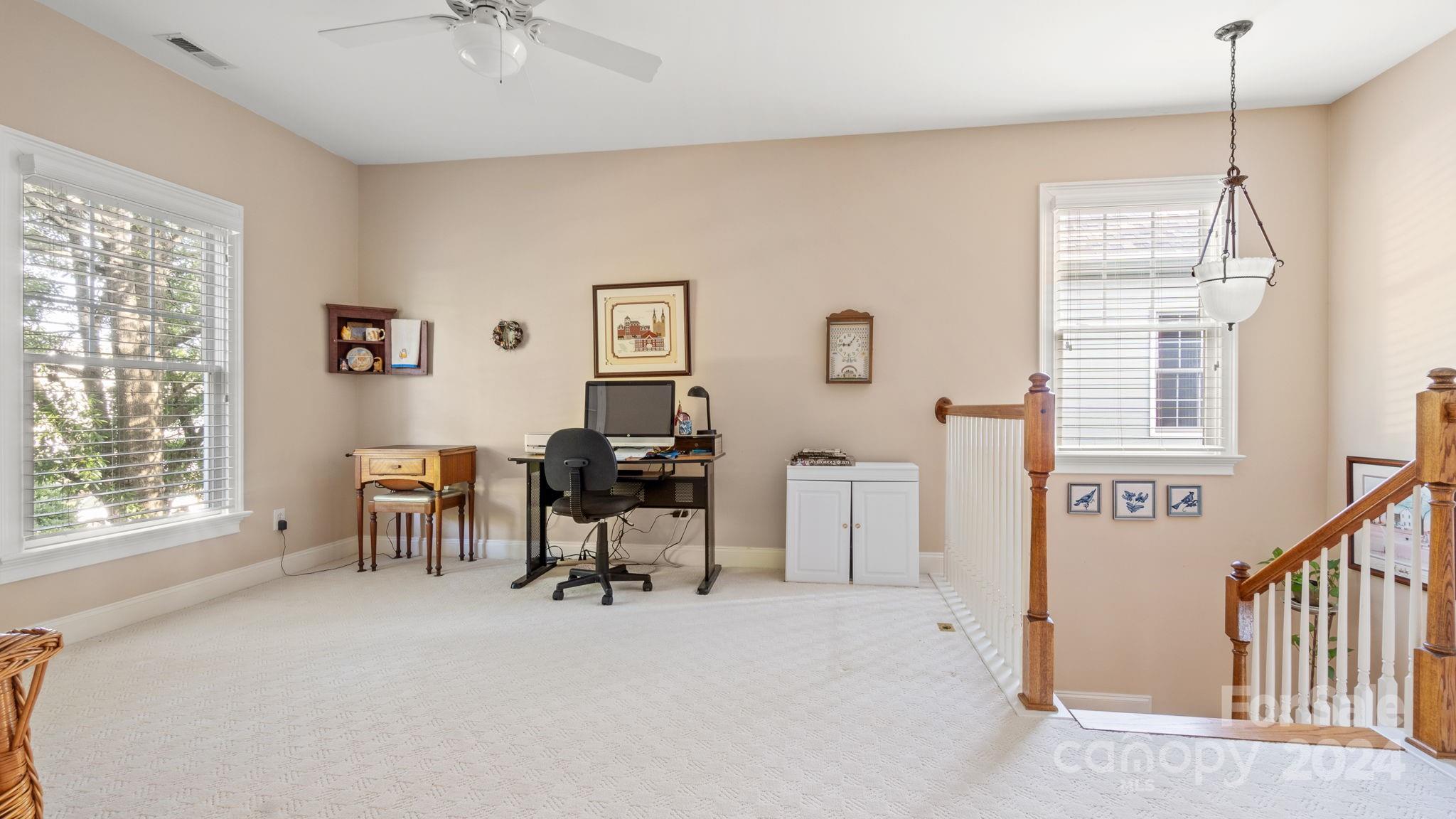 7121 Michael Scott Crossing Fort Mill, SC 29708 - Photo 23 of 46 a view of a livingroom with workspace and a window