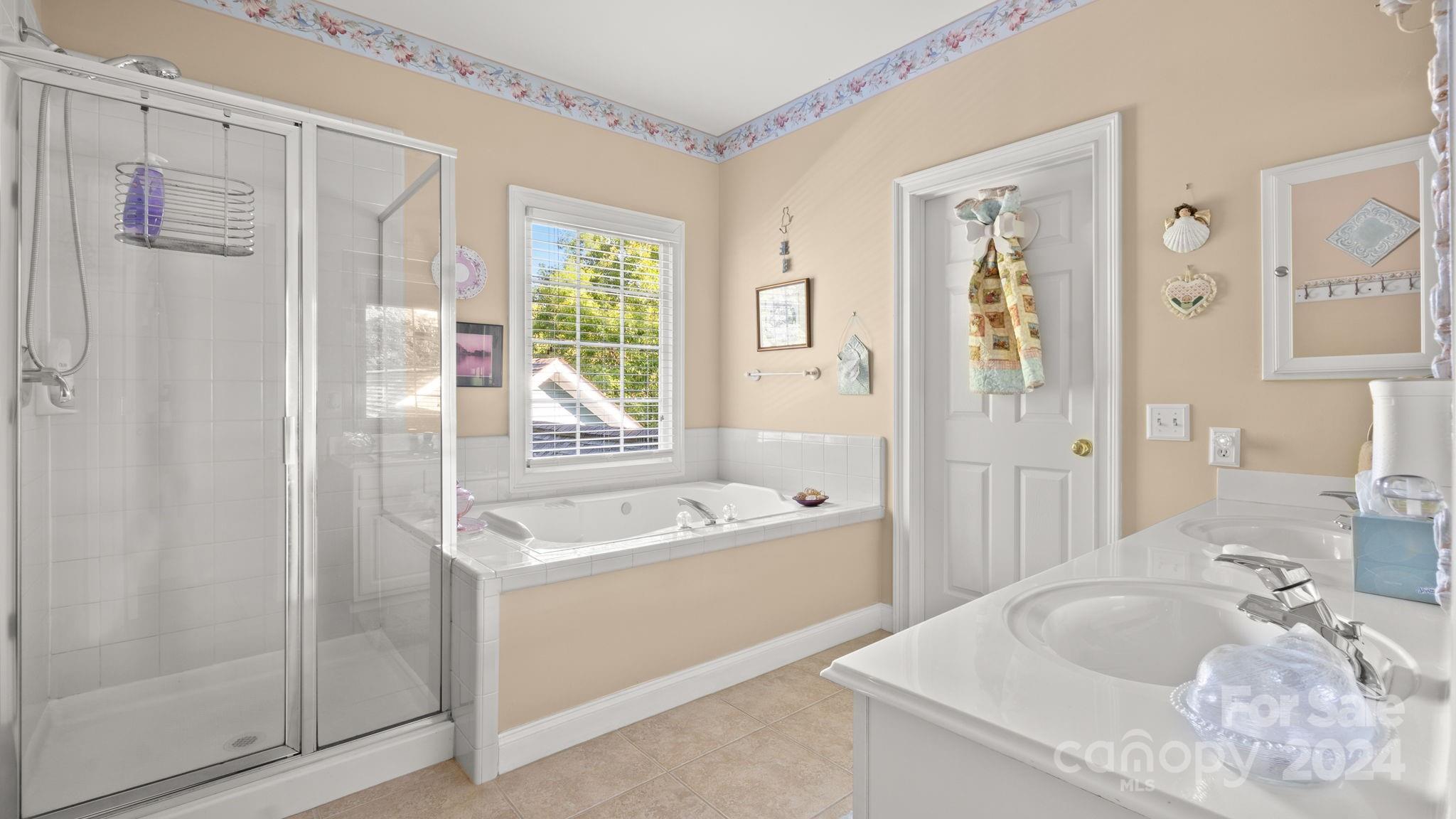 7121 Michael Scott Crossing Fort Mill, SC 29708 - Photo 27 of 46 a bath room with a sink tub and a mirror