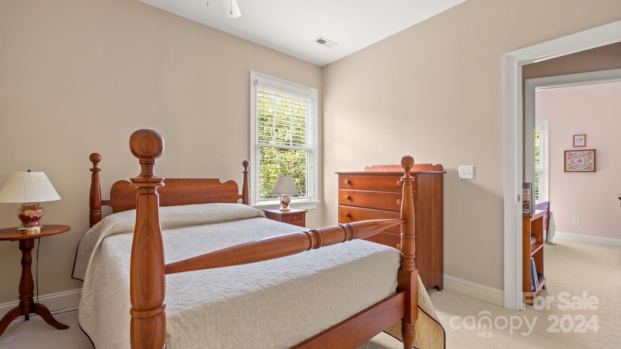 7121 Michael Scott Crossing Fort Mill, SC 29708 - Photo 32 of 46 a bed room with a bed and a book shelf