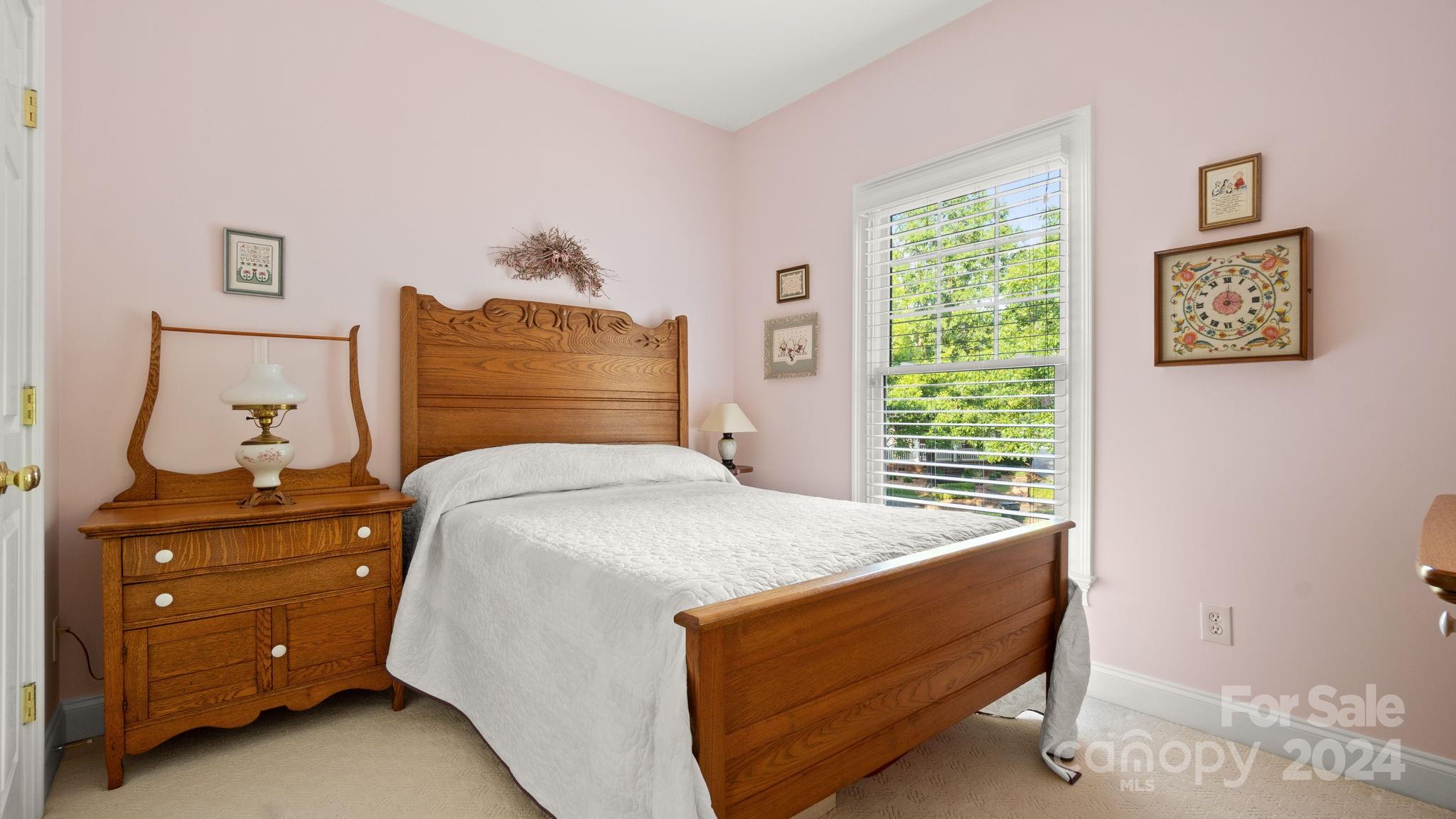 7121 Michael Scott Crossing Fort Mill, SC 29708 - Photo 33 of 46 a bedroom with a bed and a window