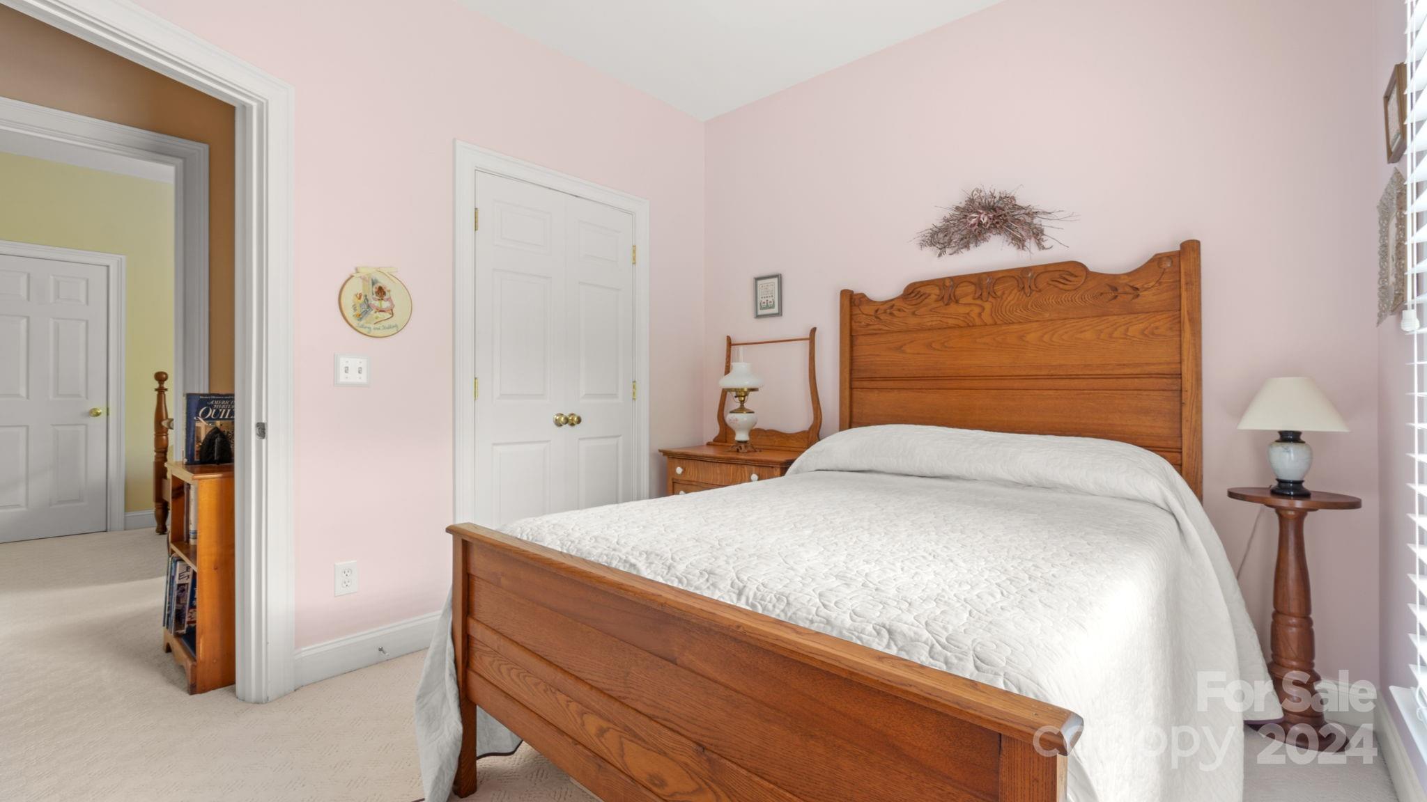 7121 Michael Scott Crossing Fort Mill, SC 29708 - Photo 34 of 46 a bedroom with a bed and a mirror